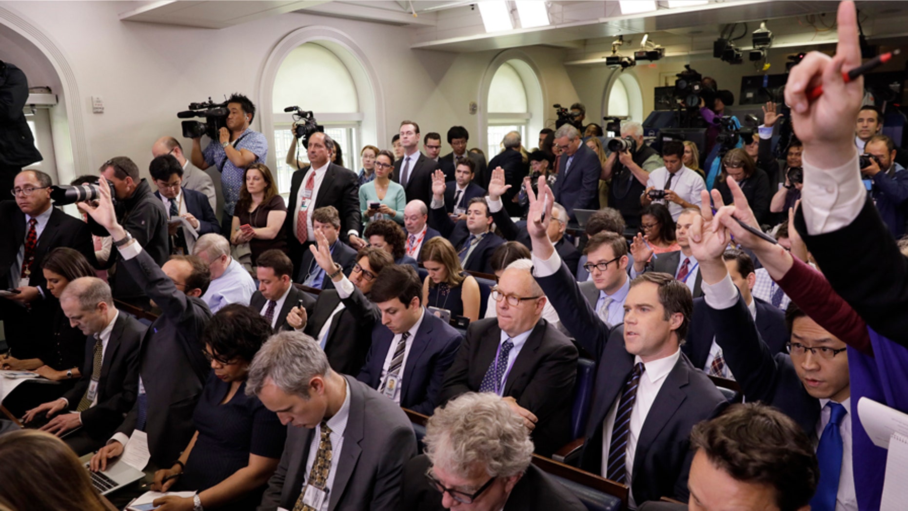 Reporters ask questions in the White House briefing room in Washington, April 26, 2017.