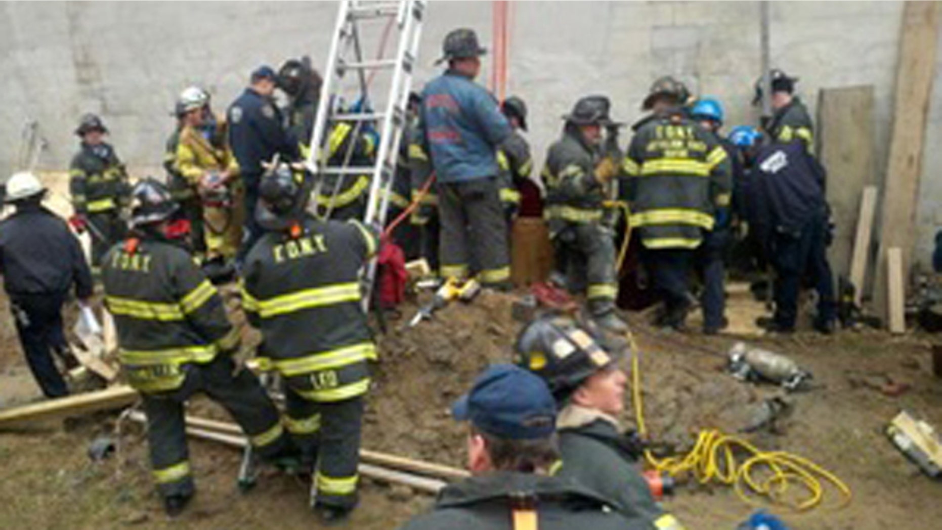 March 2: New York firefighters work to rescue a man trapped in a structural collapse in Harlem, New York.