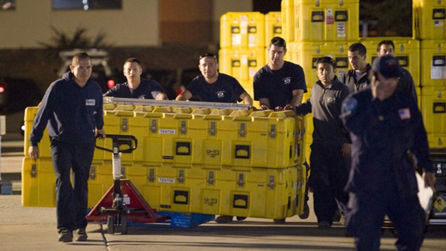 The Los Angeles County Fire Department urban search and rescue team loads equipment before heading to Haiti Jan. 12. (Reuters Photo)