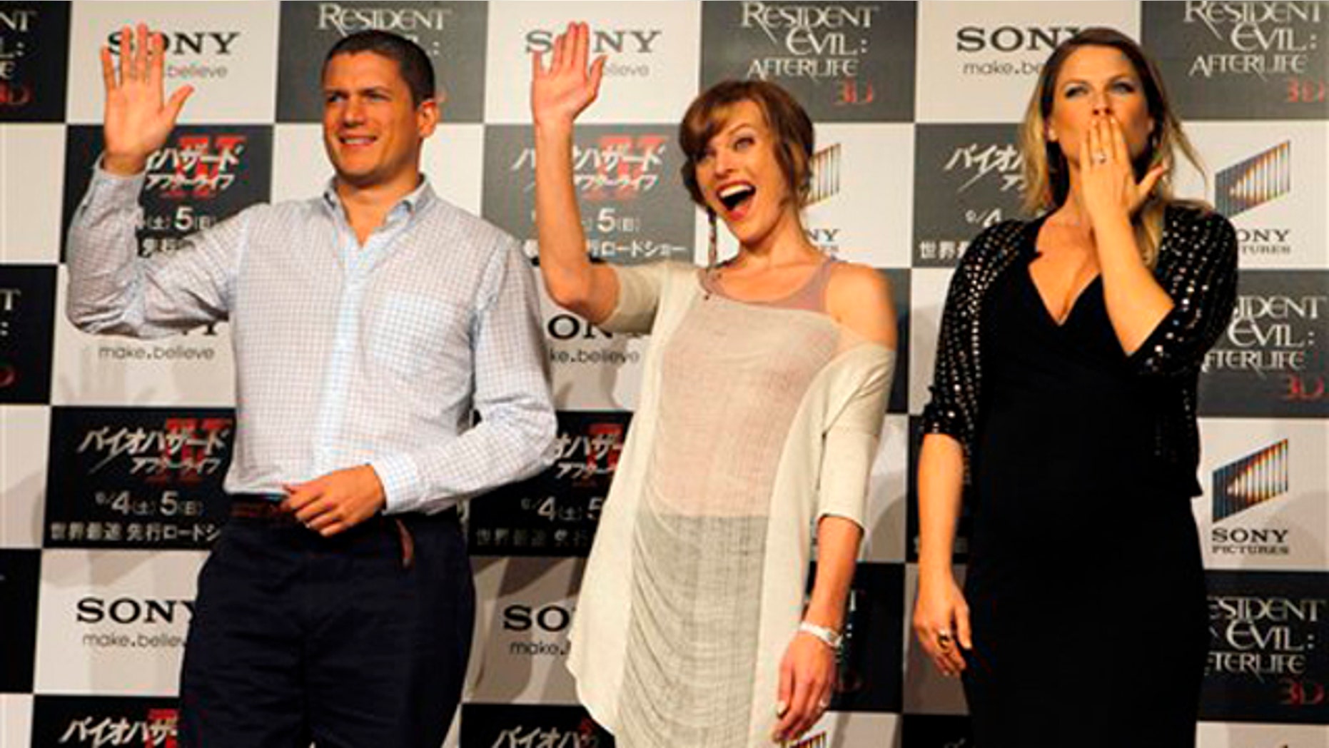 Actresses Milla Jovovich, center, Ali Larter, right, and actor Wentworth Miller react during a press conference for their film "Resident Evil: Afterlife" in Tokyo Friday, Sept. 3, 2010. (AP Photo/Junji Kurokawa)