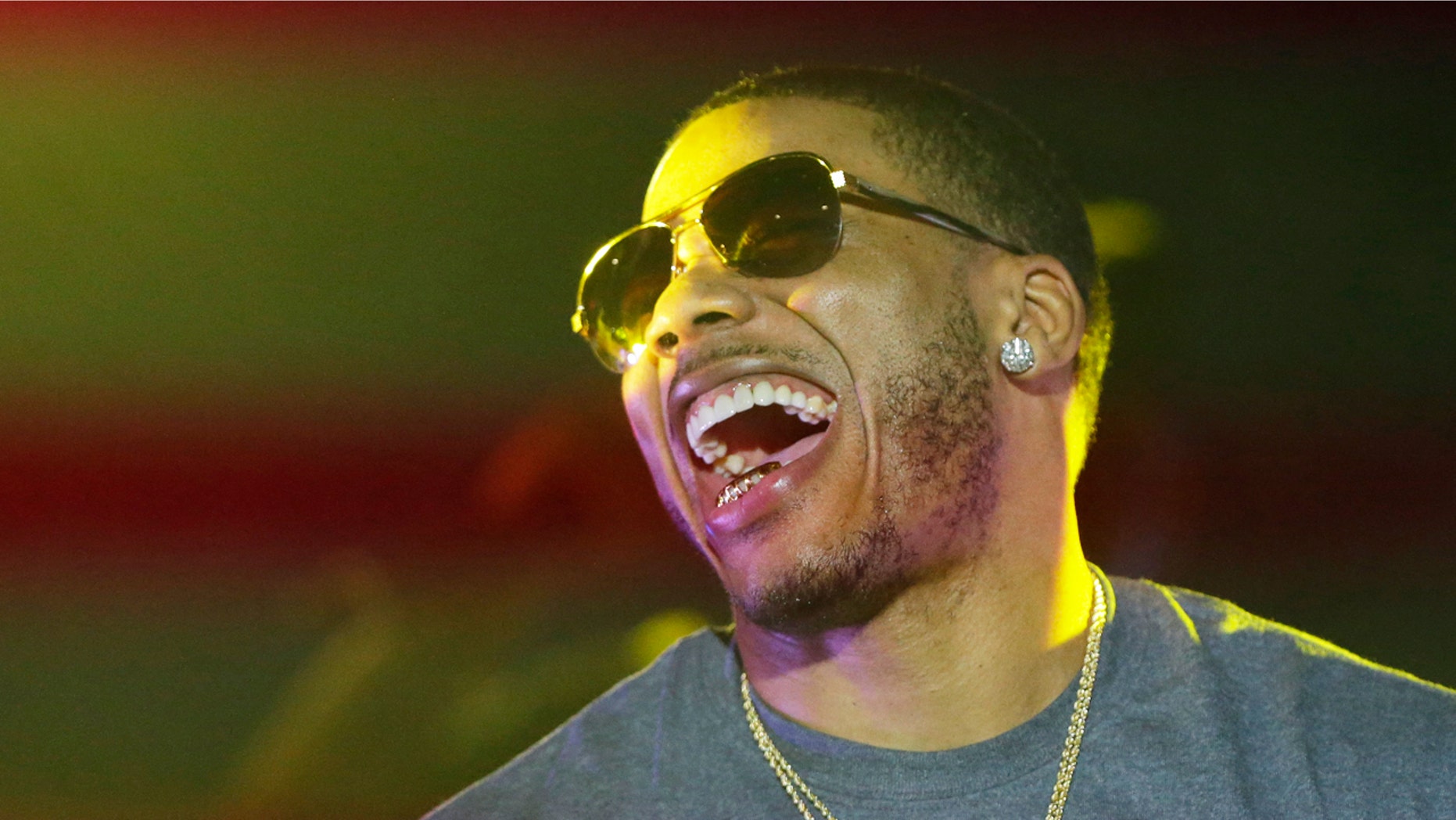 Rapper Nelly laughs on stage during a Corner Block Party concert at Auburn University in Auburn, Ala. in this April 18, 2015, file photo.