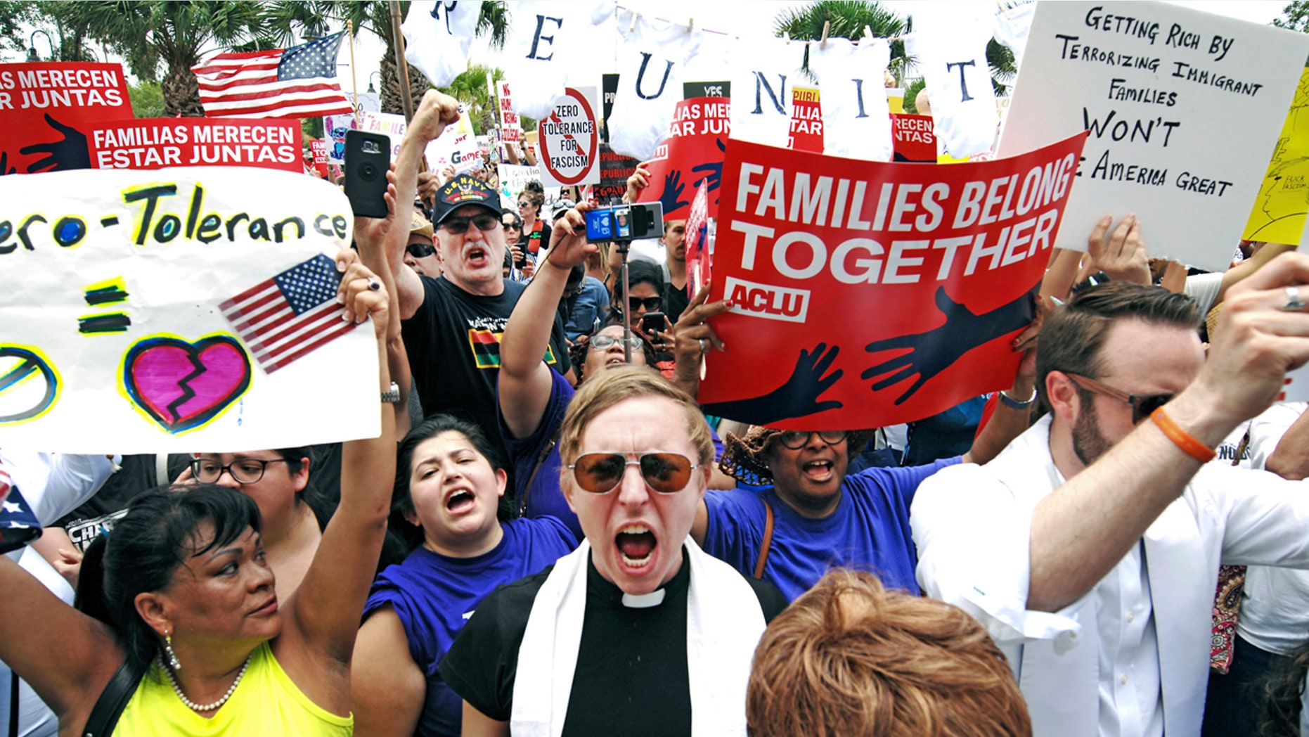 In this June 28 photo, protesters chant, "Families belong together!" as they walk to the front doors of the federal courthouse in Brownsville, Texas.