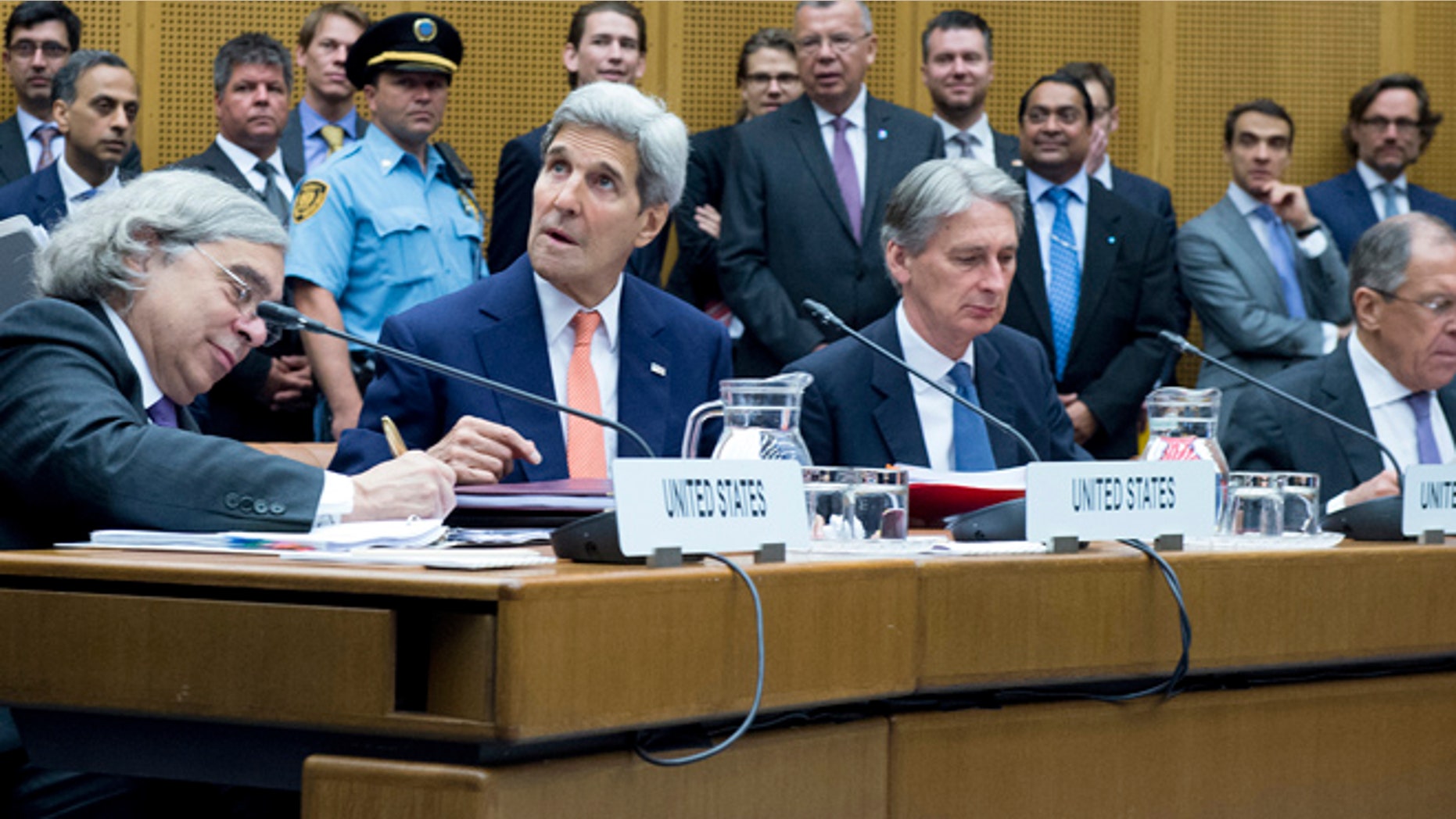 July 14: U.S. Secretary of Energy Ernest Moniz, U.S. Secretary of State John Kerry, British Foreign Secretary Philip Hammond and Russian Foreign Minister Sergey Lavrov (L-R) attend the last plenary session at the United Nations building in Vienna, Austria.