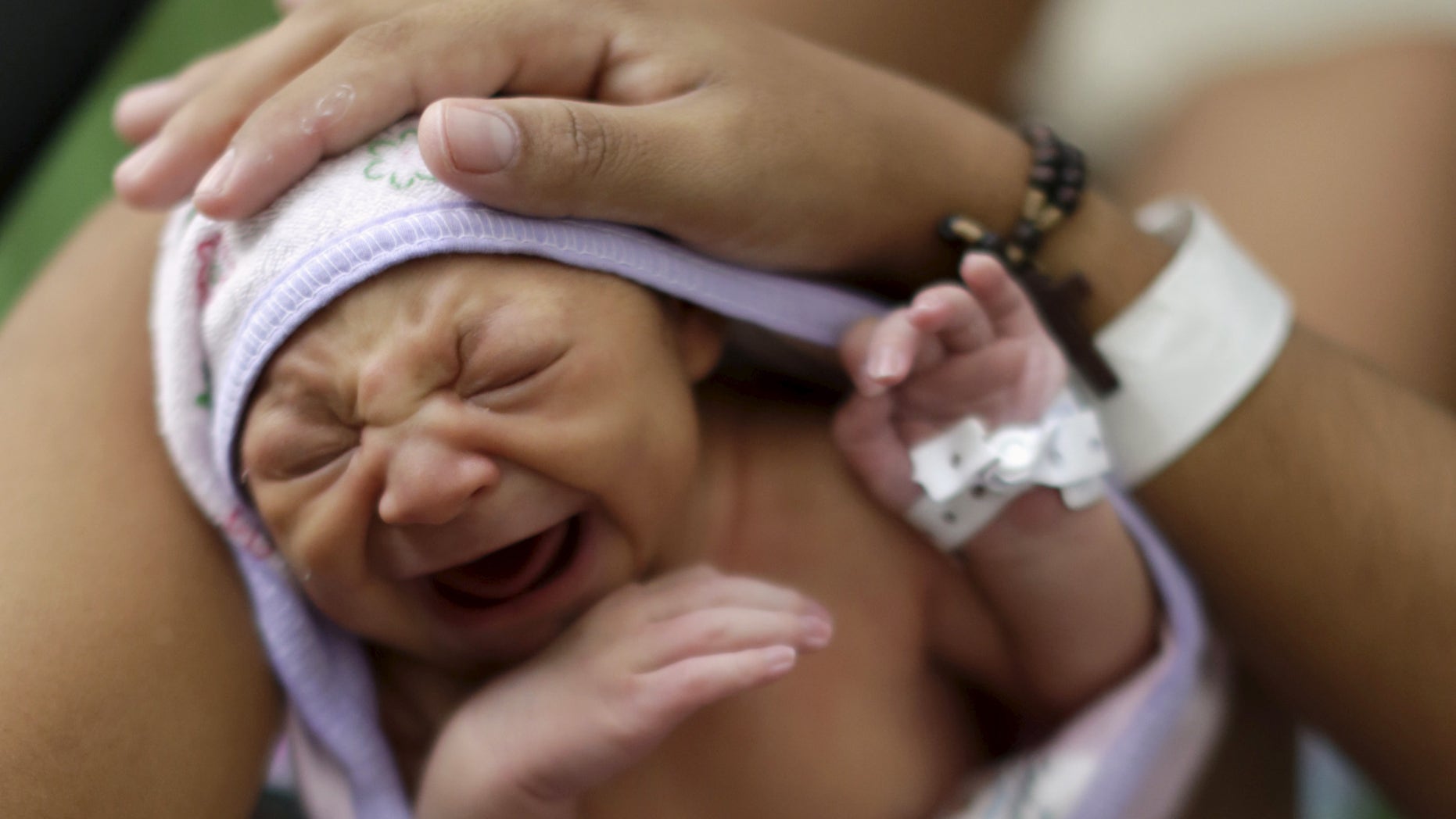 Jan. 28, 2016: Sueli Maria holds her daughter Milena, who has microcephaly, at a hospital in Recife, Brazil.