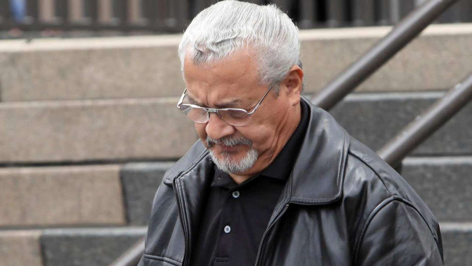 Former Chicago police detective Reynaldo Guevara leaves a Chicago courtroom, July 29, 2013.