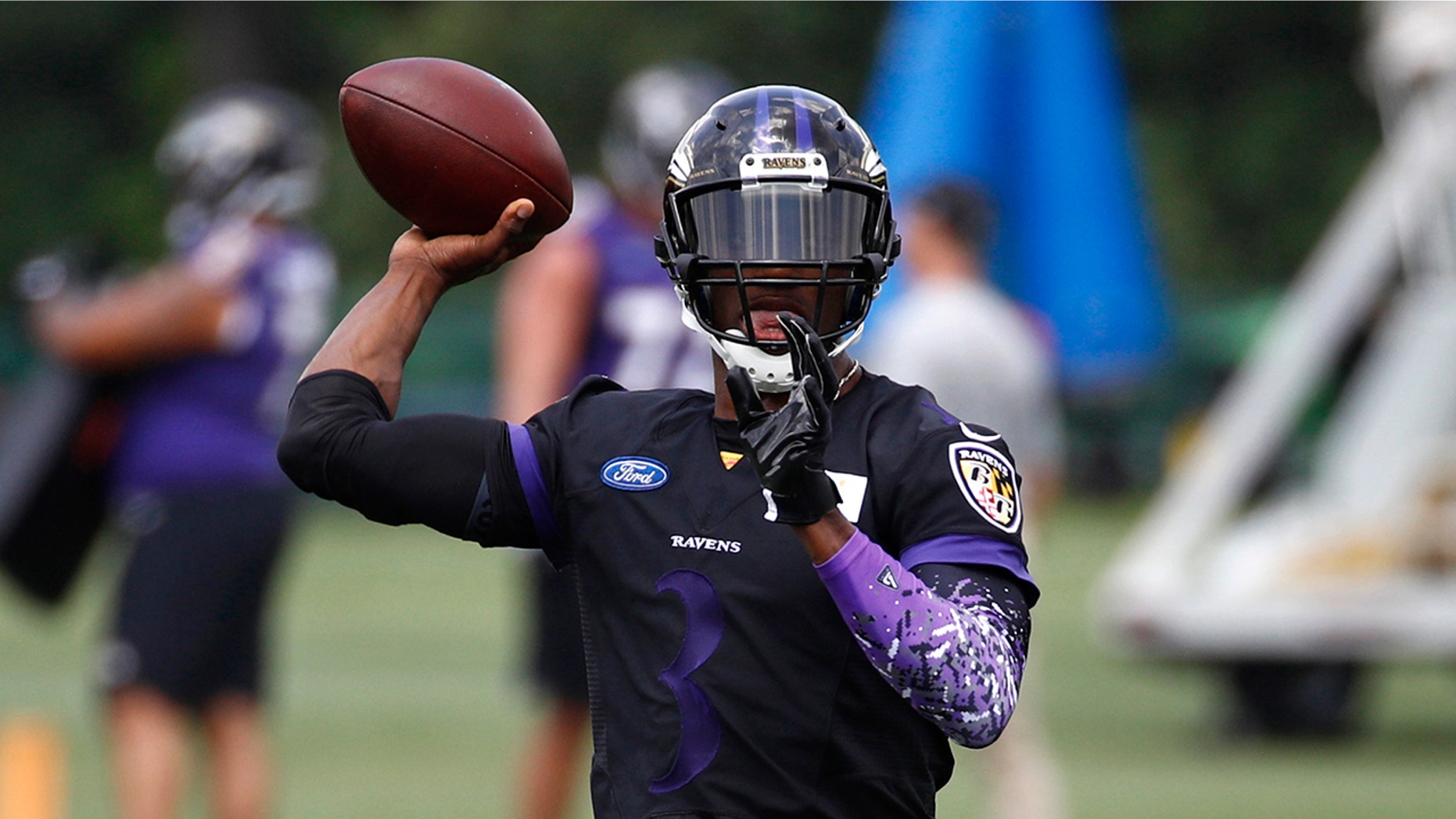 Baltimore Ravens quarterback Robert Griffin III throws a pass during an NFL football training camp practice at the team's headquarters, Friday, July 20, 2018, in Owings Mills, Md. (AP Photo/Patrick Semansky)