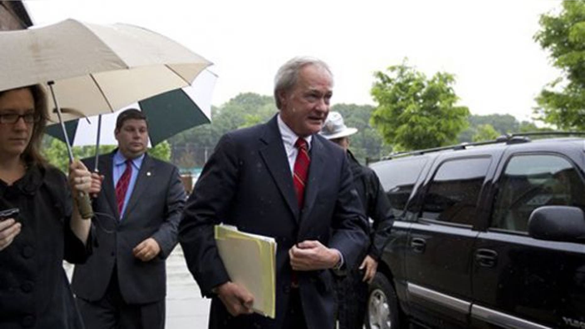 May 21, 2012: Rhode Island Gov. Lincoln Chafee, center, arrives at the state's Economic Development Corp. headquarters in Providence, R.I.