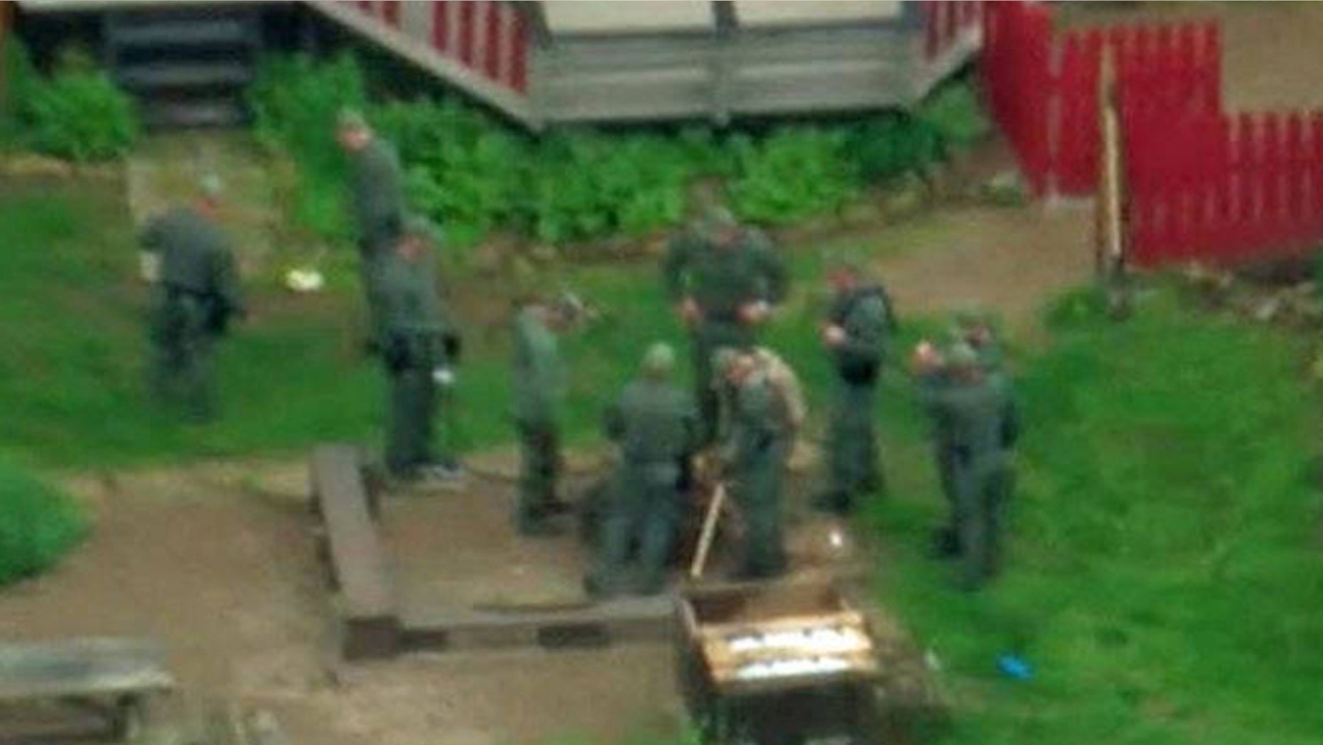 SWAT team searched a farm in Adams County Friday in connection with the Rhoden family murder probe.