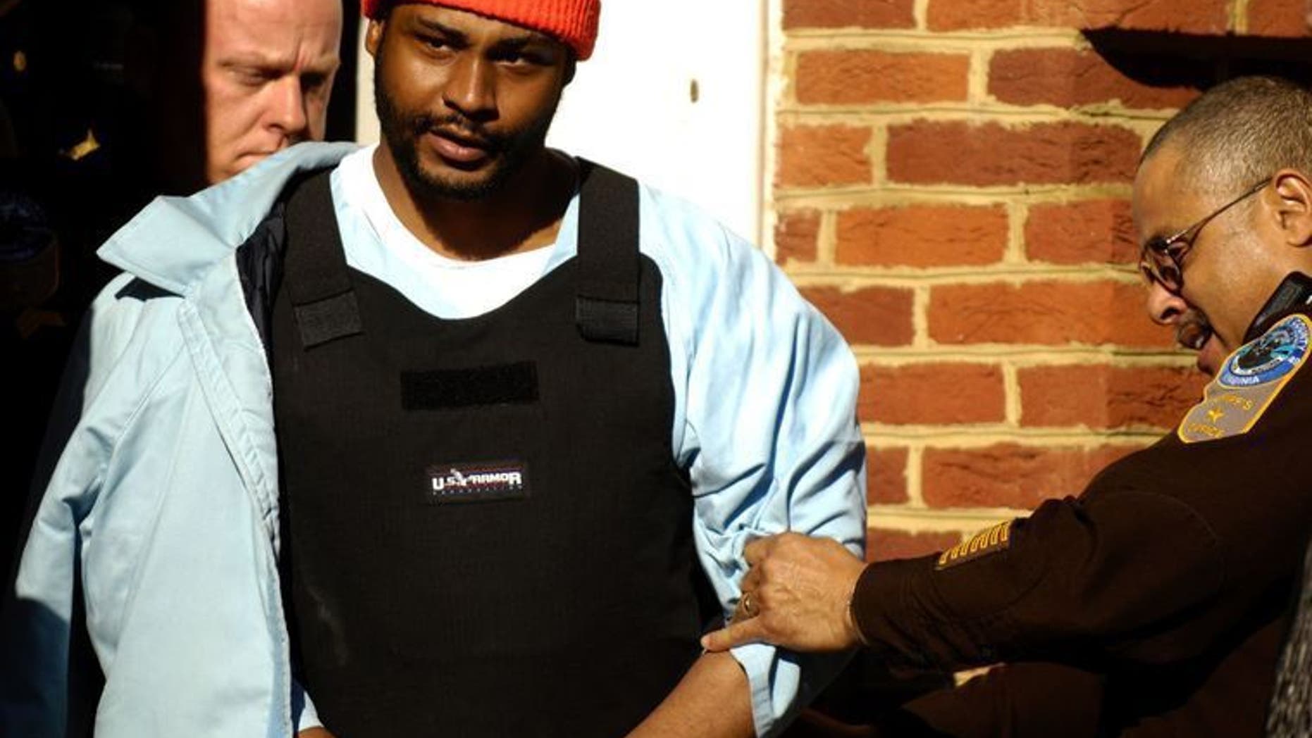 Ricky Gray escorted from the courthouse in 2007.