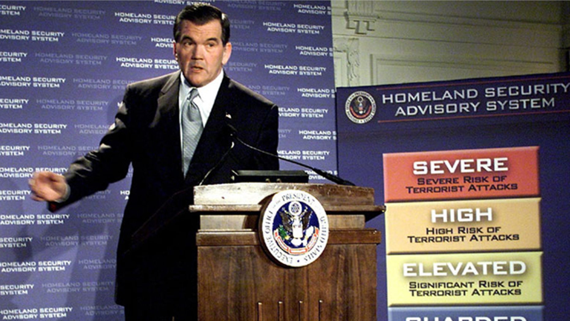 In this March 12, 2002, file photo, then-Homeland Security Director Tom Ridge discusses a color-coded terror alert system in Washington. (AP Photo)
