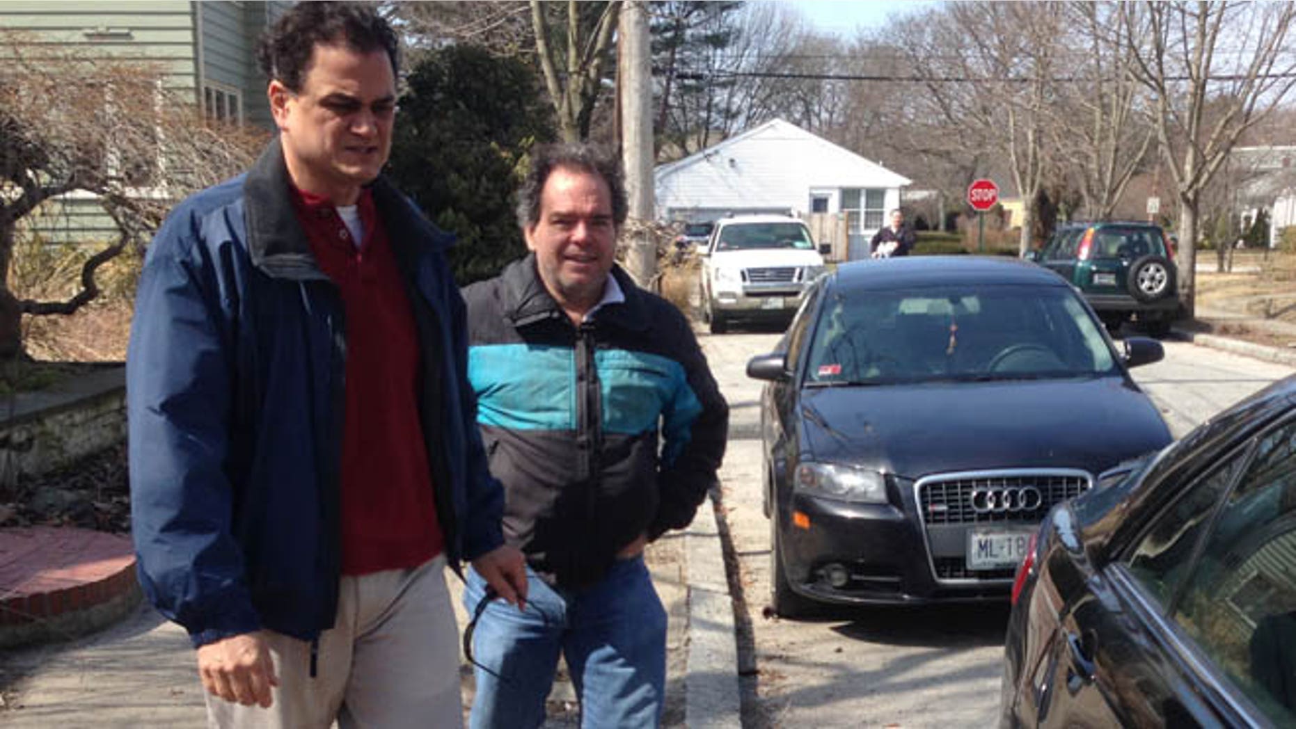 Mar. 22, 2014: Rhode Island House Speaker Gordon Fox speaks to a reporter as he emerges from his home in Providence, R.I..
