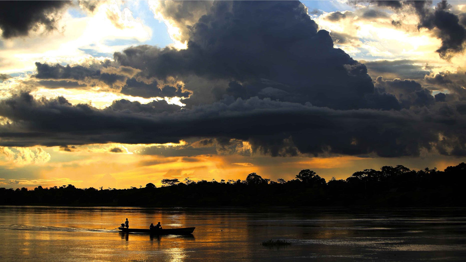 IQUITOS, PERU - JUNE 08: A view of the Northern Peruvian Amazon River on June 8, 2007 from the town of Nauta to the town of Trometeros, Peru. This pristine river and massive rainforest is under threat from infrastructure development in Peru. The Achuar Indian people of this Northern region recently won a legal battle with Argentinian Oil giant PlusPetrol to stop them dumping waste oil water, so called "hot-water" into their water supply. The amount is estimated at around 500 000 barrels a day over a period of 30 years. This has played havoc with the eco-systems around the town of Trompeteros. The oil company has yet to make good on its promises for payment and transparency. The oil company provides the bulk of employment for the polluted town of Trompeteros and thus has the local Achuan population under pressure to not pay attention to the pollution levels. The Achuan people are faced with a choice between a centuries old sustainable lifestyle in harmony with the environment or a move towards increased devastation of their natural lands in the Amazon basin by the oil industry. (Photo by Brent Stirton/Getty Images)
