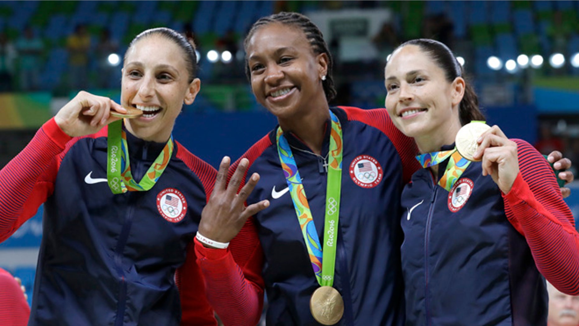 United States' Diana Taurasi, left, Tamika Catchings, center, and Sue Bird, right, celebrate with their gold medals after their win in a women's basketball game against Spain at the 2016 Summer Olympics in Rio de Janeiro, Brazil, Saturday, Aug. 20, 2016. (AP Photo/Eric Gay)