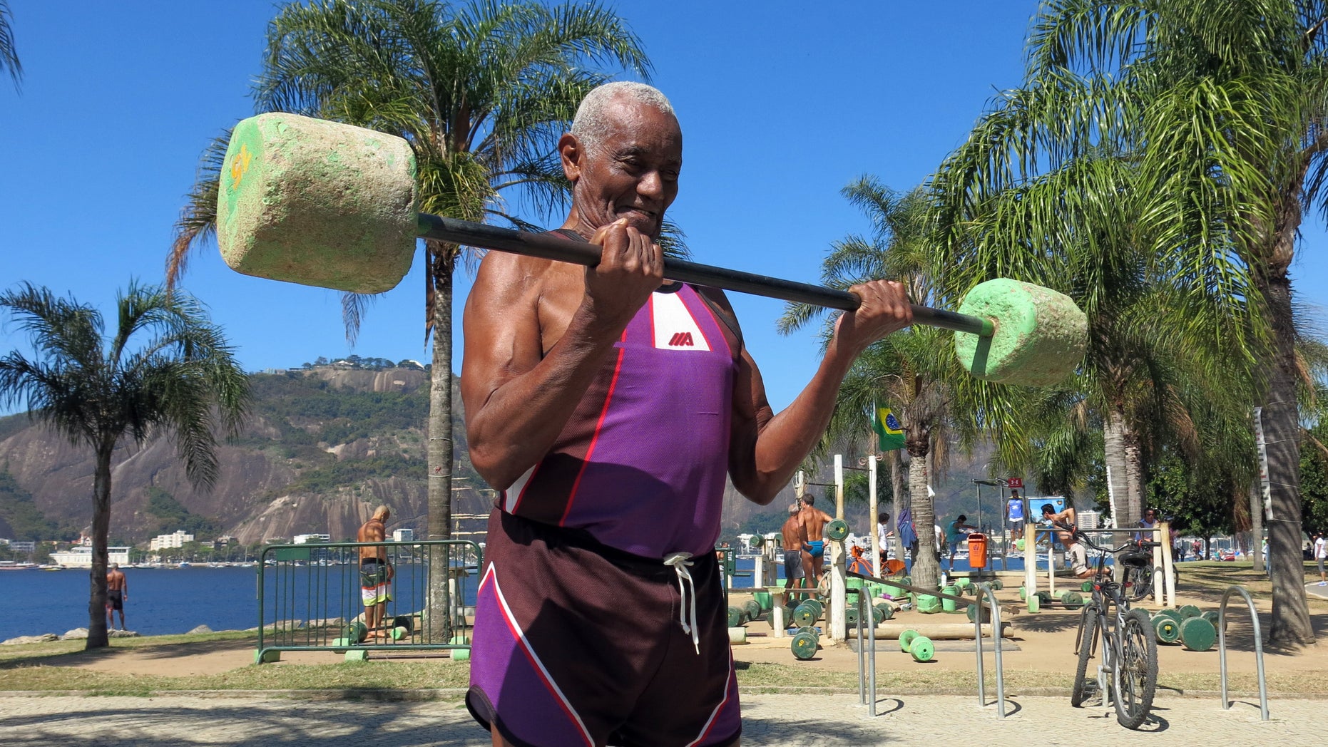 Jose Rebamar, 75, lifts weights at an outside gym in Rio de Janeiro, Brazil, Sunday, Aug. 14, 2016.