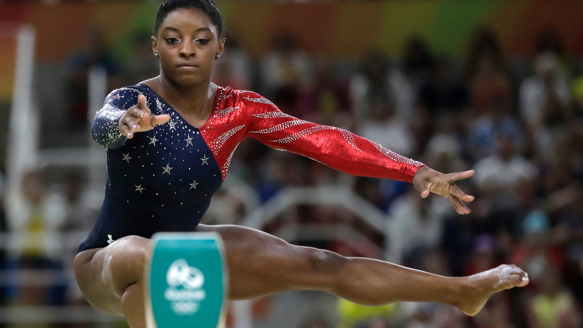 United States' Simone Biles performs on the balance beam during the artistic gymnastics women's qualification at the 2016 Summer Olympics in Rio de Janeiro, Brazil, Sunday, Aug. 7, 2016. (AP Photo/Julio Cortez)