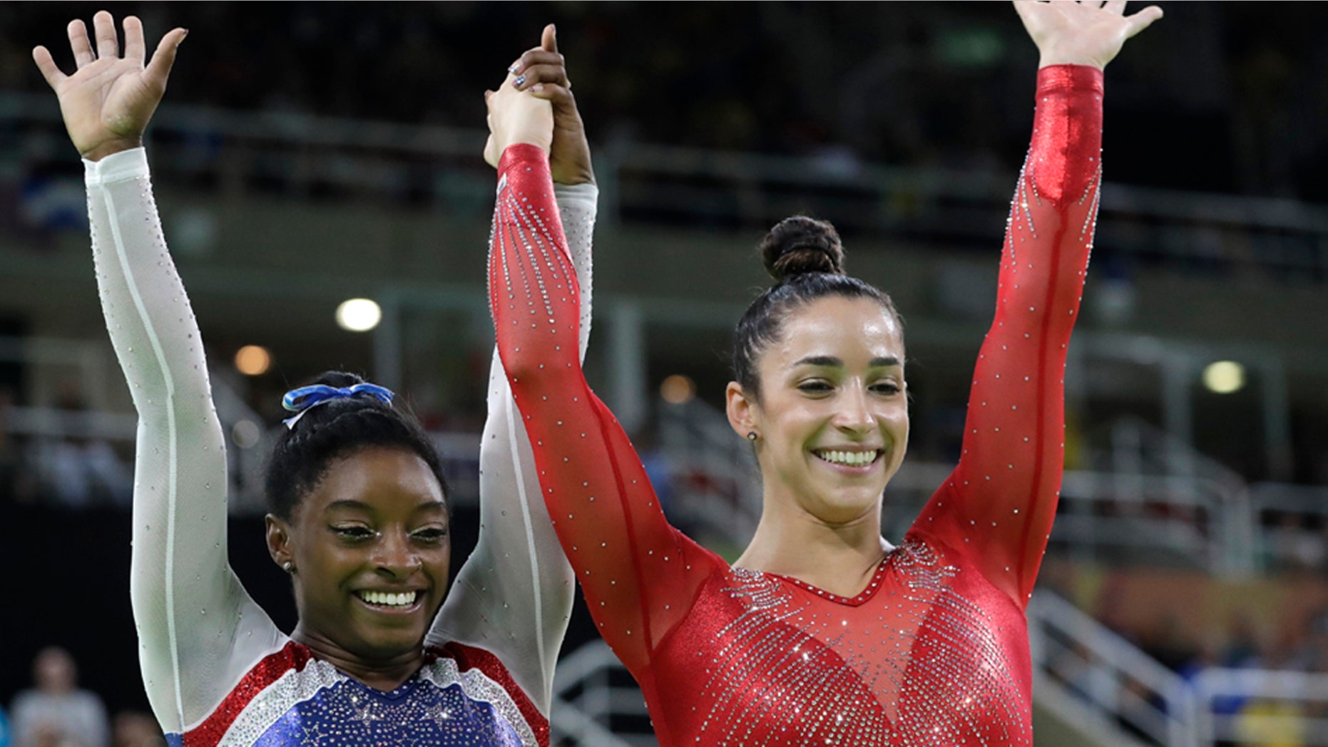 Aug. 11, 2016: United States' Simone Biles, left, and Aly Raisman celebrate after winning gold and silver respectively for the artistic gymnastics women's individual all-around final at the 2016 Summer Olympics in Rio de Janeiro, Brazil.