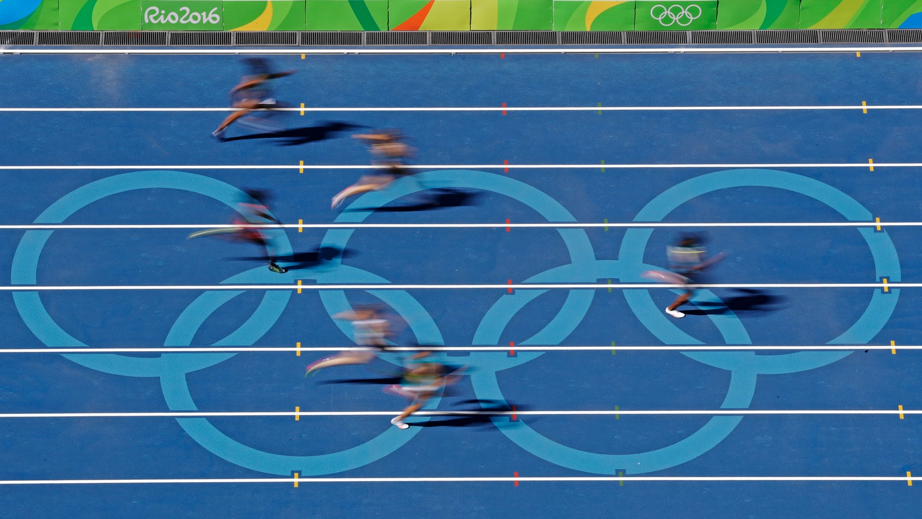 Runners compete in a 400 meter heat during the athletics competitions of the 2016 Summer Olympics at the Olympic stadium in Rio de Janeiro, Brazil, Saturday, Aug. 13, 2016. (AP Photo/Morry Gash)