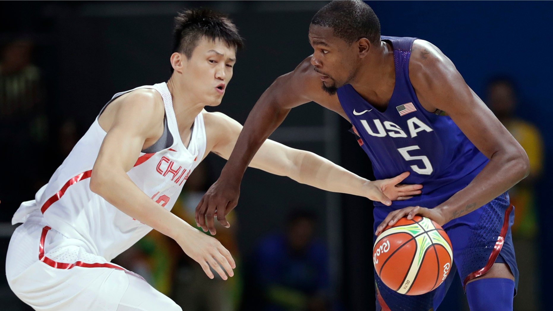 Aug. 6, 2016: United States' Kevin Durant (5) drives past China's Zou Peng, left, during a basketball game at the 2016 Summer Olympics in Rio de Janeiro, Brazil