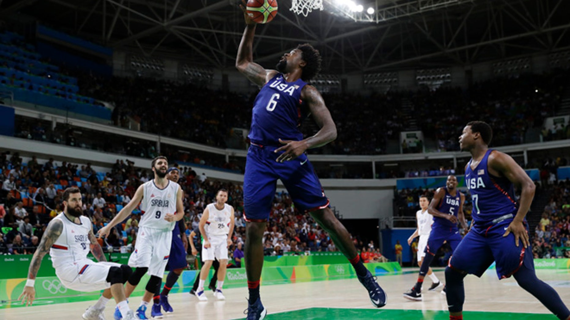 United States' DeAndre Jordan (6) pulls in a rebound against Serbia during the men's gold medal basketball game at the 2016 Summer Olympics in Rio de Janeiro, Brazil, Sunday, Aug. 21, 2016.
