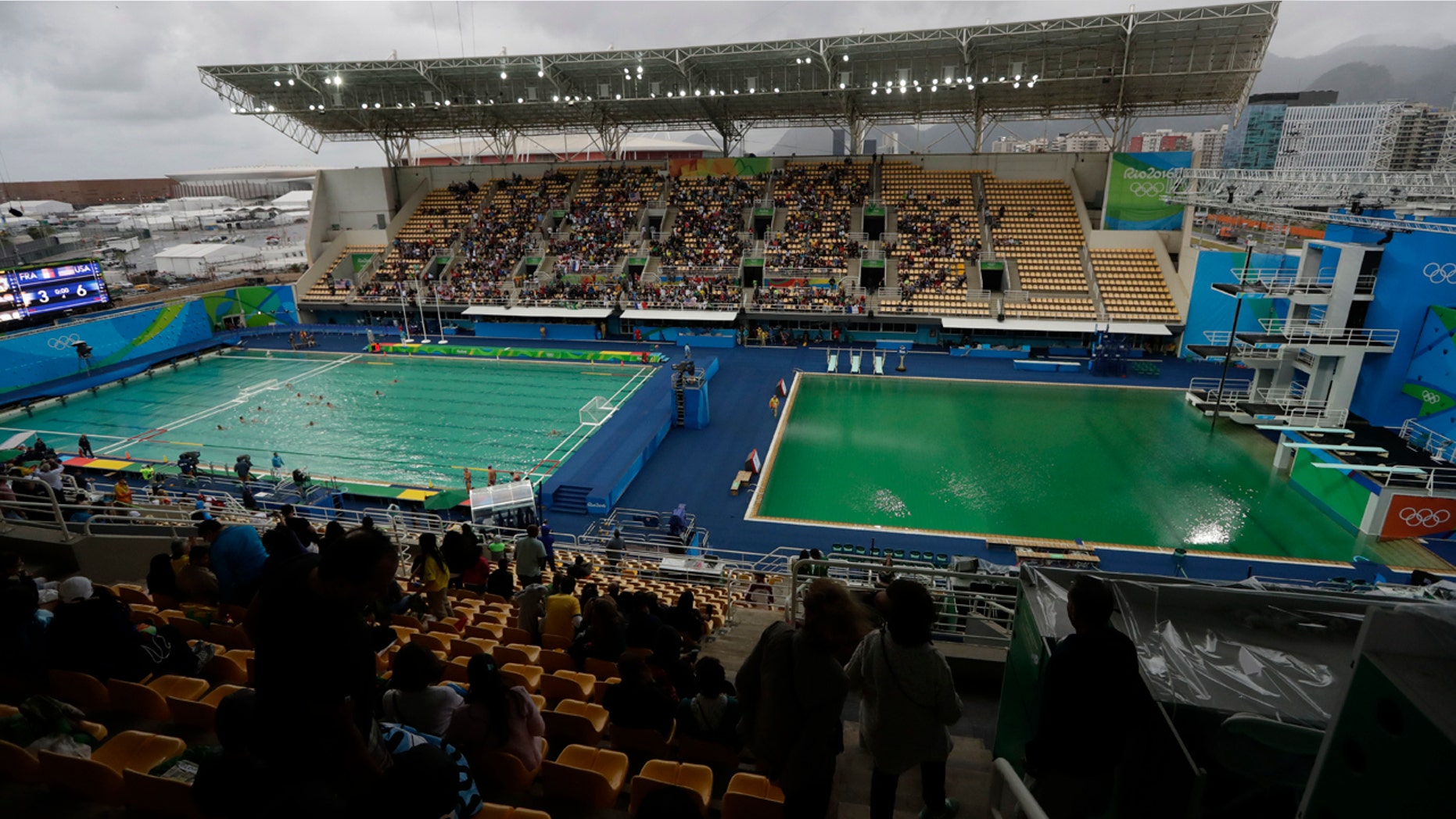 Aug. 10, 2016: The water of the diving pool at right appears a murky green as the water polo pool at left appears a greener color than the previous day during a preliminary round match between United States and France in the Maria Lenk Aquatic Center at the 2016 Summer Olympics in Rio de Janeiro, Brazil.