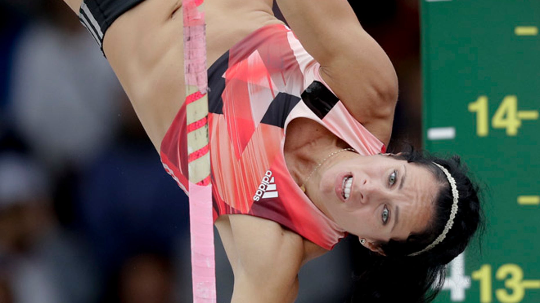 In this July 10, 2016 file photo, Jenn Suhr clears the bar during the women's pole vault final at the U.S. Olympic Track and Field Trials in Eugene Oregon.