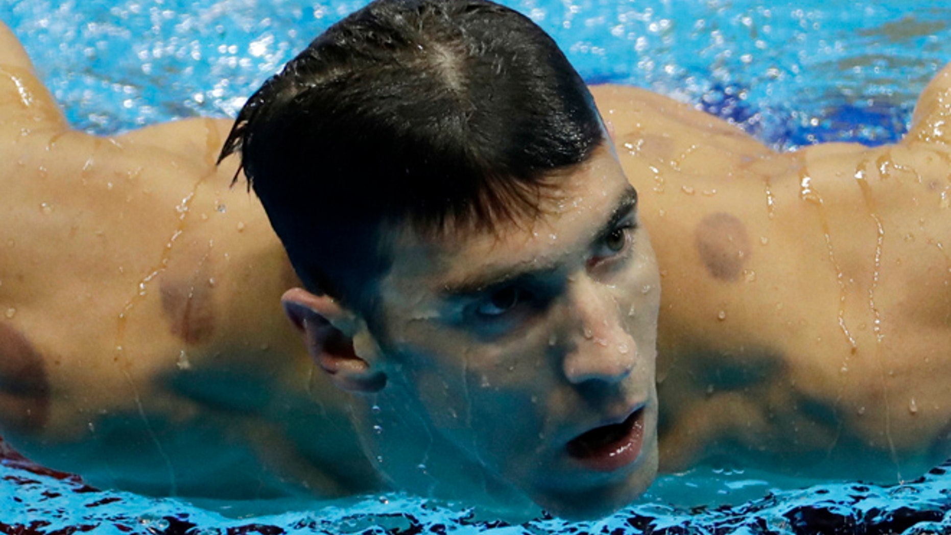 United States' Michael Phelps leaves the pool after winning a heat of the men's 200-meter individual medley during the swimming competitions at the 2016 Summer Olympics, Wednesday, Aug. 10, 2016, in Rio de Janeiro, Brazil. (AP Photo/Matt Slocum)
