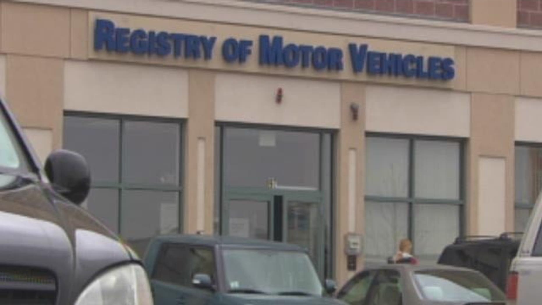 Four Massachusetts RMV workers are accused in a scheme to get fake IDs for illegal immigrants.