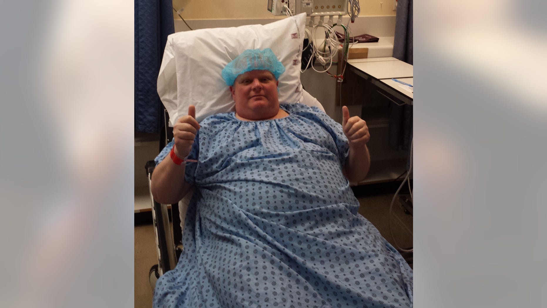 Former Toronto mayor Rob Ford gives the thumbs up sign before cancer surgery at Mount Sinai Hospital in Toronto.