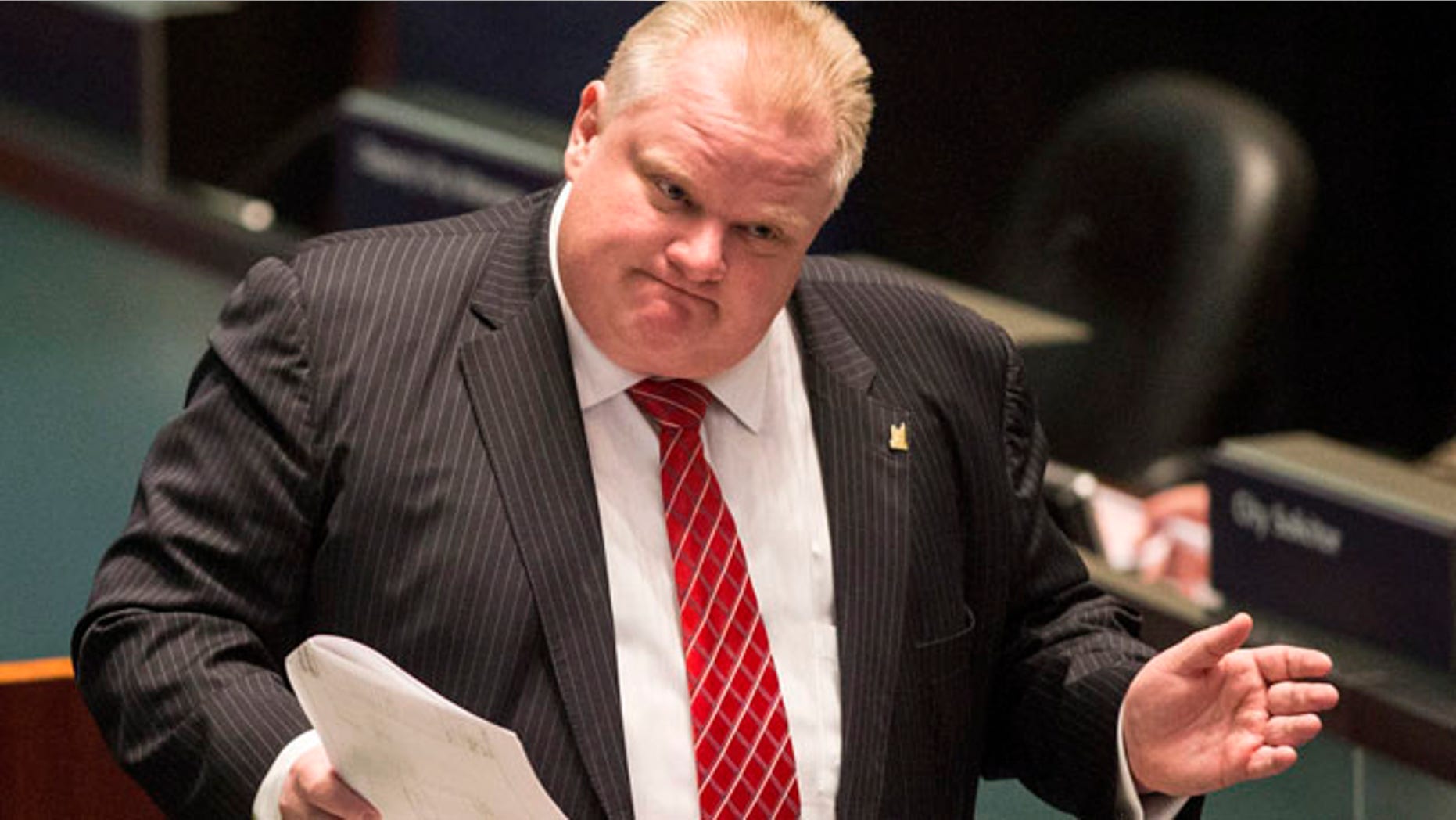 Nov. 18, 2013: Toronto Mayor Rob Ford attends a council meeting as councilors look to pass motions to limit his powers in Toronto.