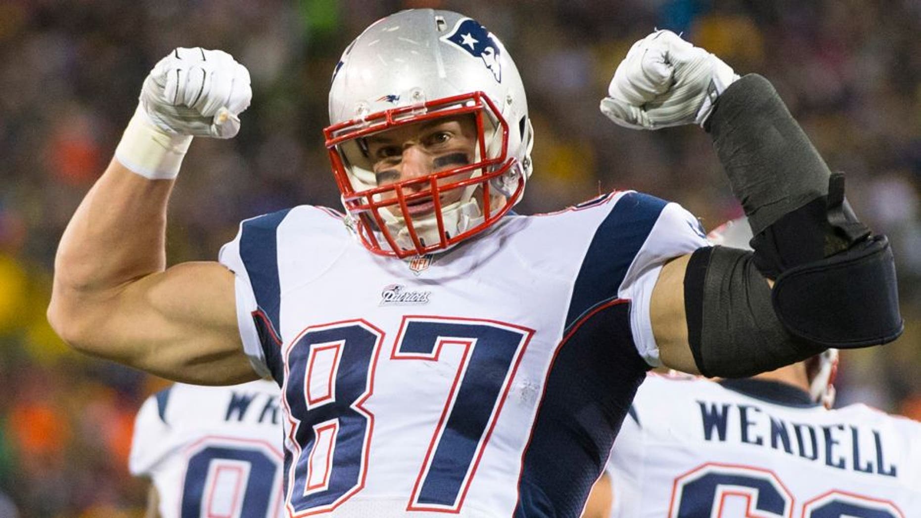 Nov 30, 2014; Green Bay, WI, USA; New England Patriots tight end Rob Gronkowski (87) celebrates following a play during the second quarter against the Green Bay Packers at Lambeau Field. Mandatory Credit: Jeff Hanisch-USA TODAY Sports