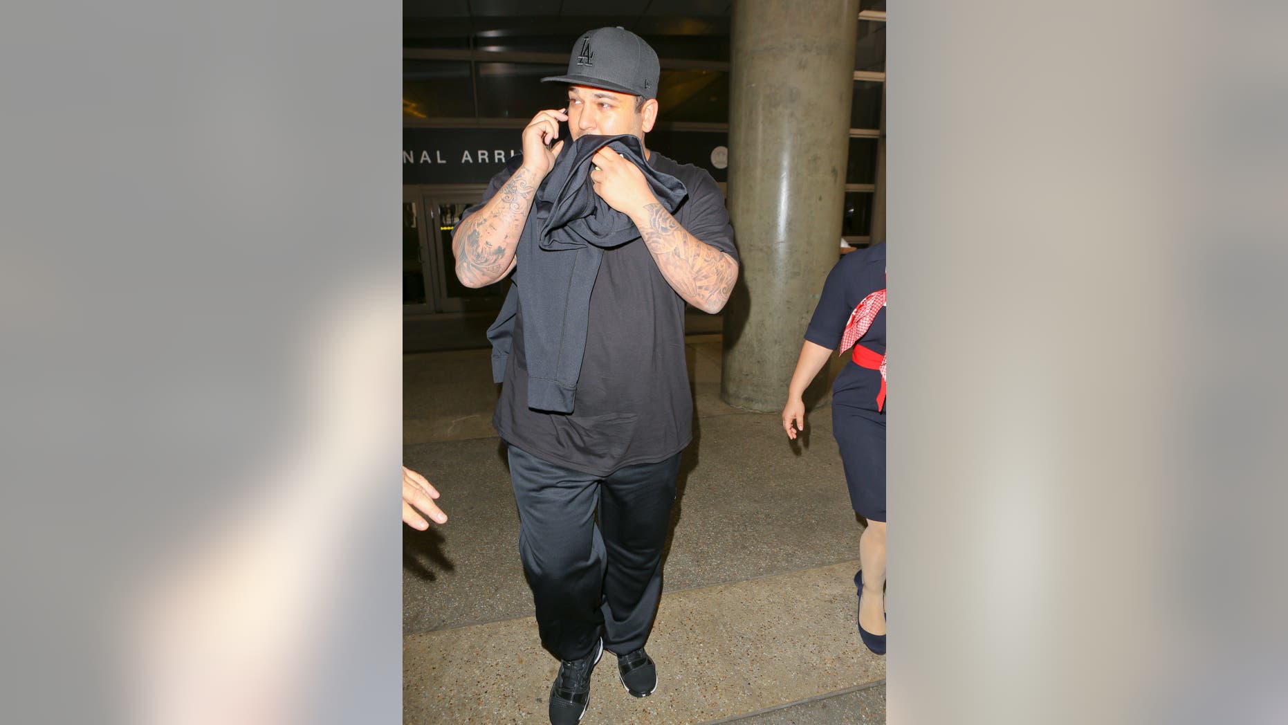 May 24, 2014. Rob Kardashian at Los Angeles airport after he missed his sister Kim Kardashian's wedding.
