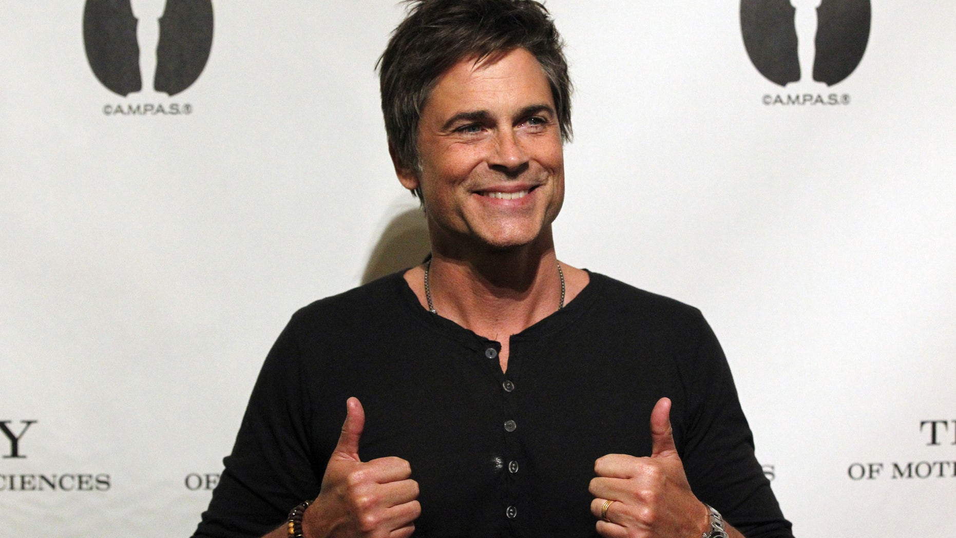 Cast member Rob Lowe poses before a screening and panel discussion for the reunion of the cast of the 1992 movie "Wayne's World" at the Academy of Motion Picture Arts and Sciences in Beverly Hills, California April 23, 2013. REUTERS/Mario Anzuoni (UNITED STATES - Tags: ENTERTAINMENT) - RTXYXOG