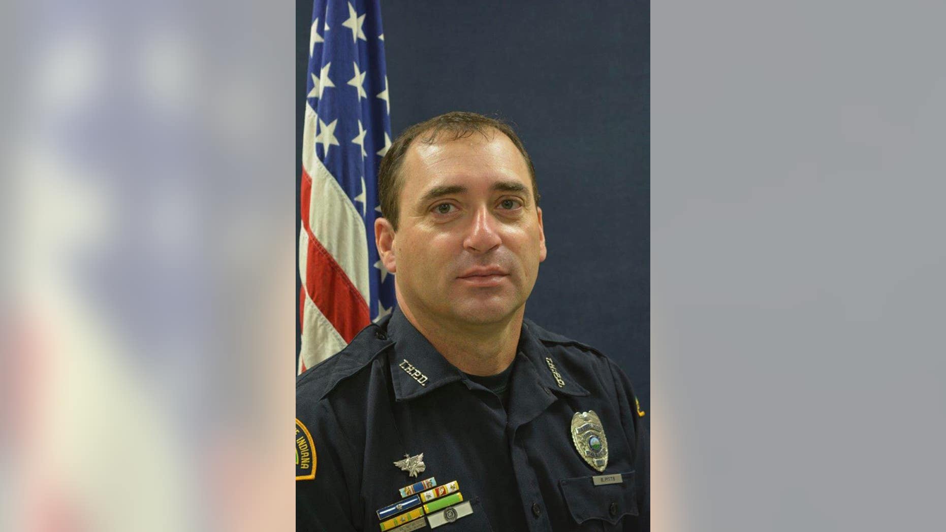 A police officer slain Friday in Terre Haute, Ind., was investigating a homicide, authorities said.