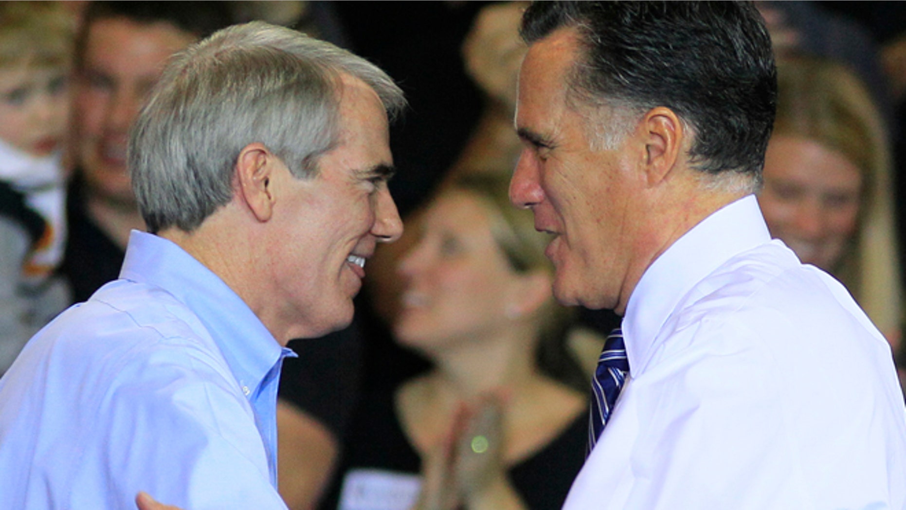 Oct. 25, 2012: In this file photo, Sen. Rob Portman, R-Ohio, left, shakes hands with Republican presidential candidate, former Massachusetts Gov. Mitt Romney after Portman introduced Romney at a campaign stop at defense contractor Jet Machine in Cincinnati.