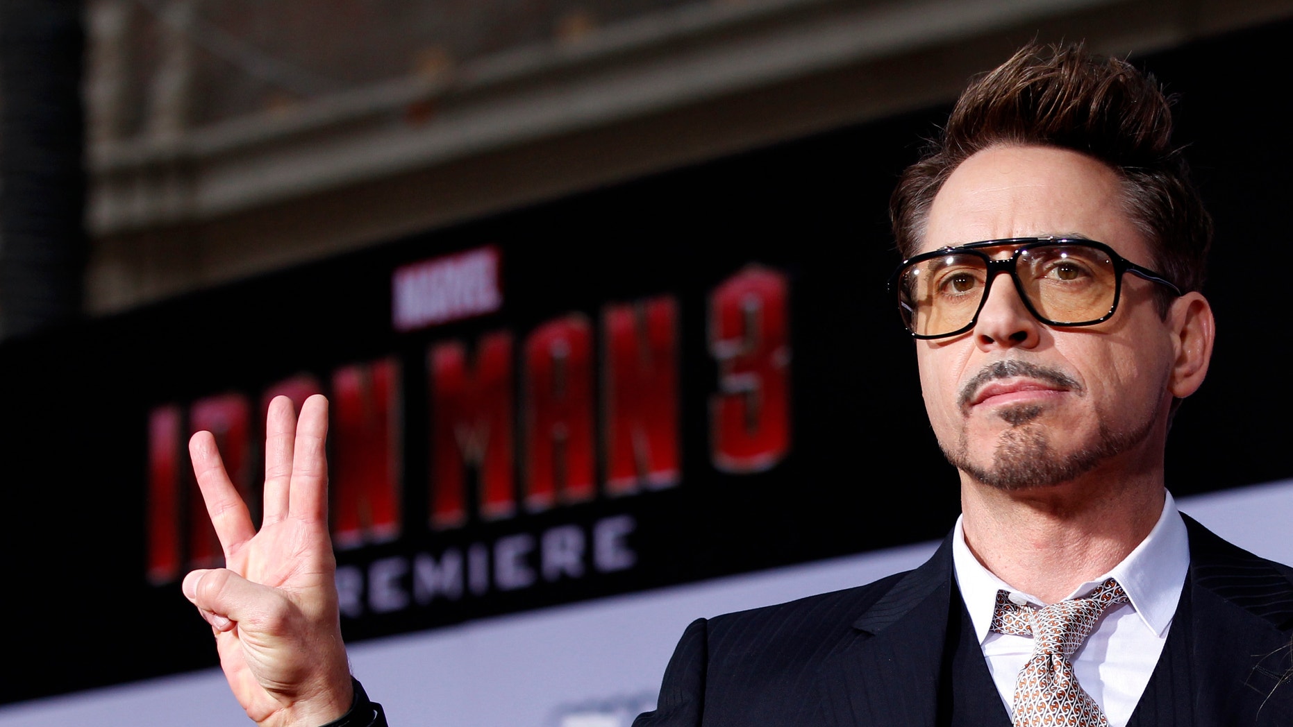 Cast member Robert Downey Jr. poses at the premiere of "Iron Man 3" at El Capitan theatre in Hollywood, California April 24, 2013.