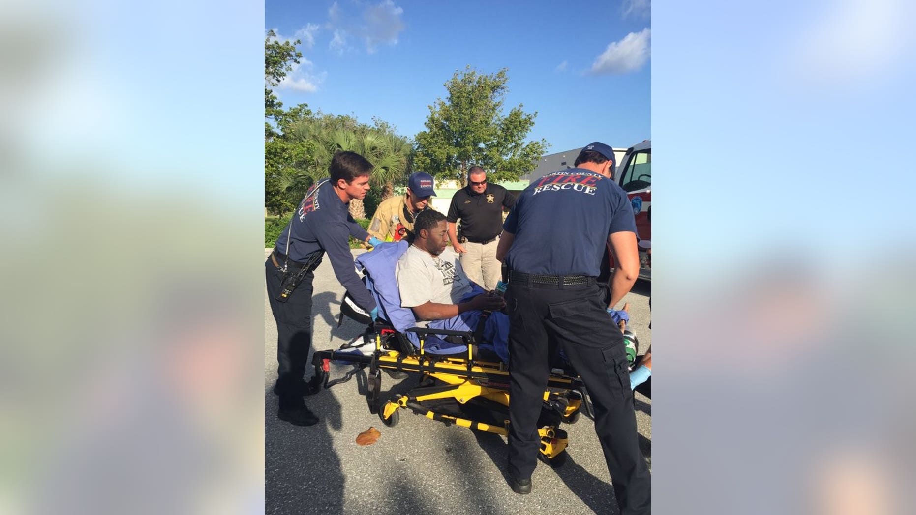 Paramedics tending to Robert Stewart.