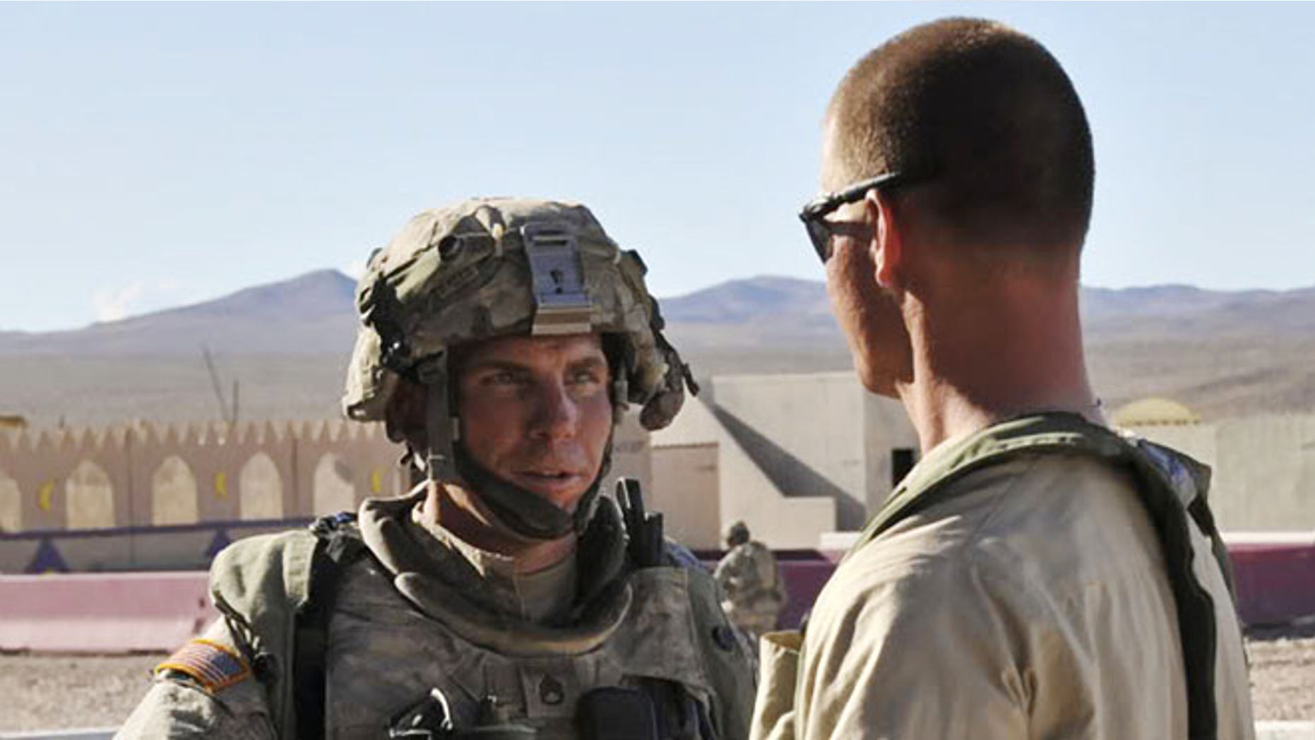 Aug. 23, 2011: In this file photo, Staff Sgt. Robert Bales, left, 1st platoon sergeant, Blackhorse Company, 2nd Battalion, 3rd Infantry Regiment, 3rd Stryker Brigade Combat Team, 2nd Infantry Division participates in an exercise at the National Training Center at Fort Irwin, Calif.