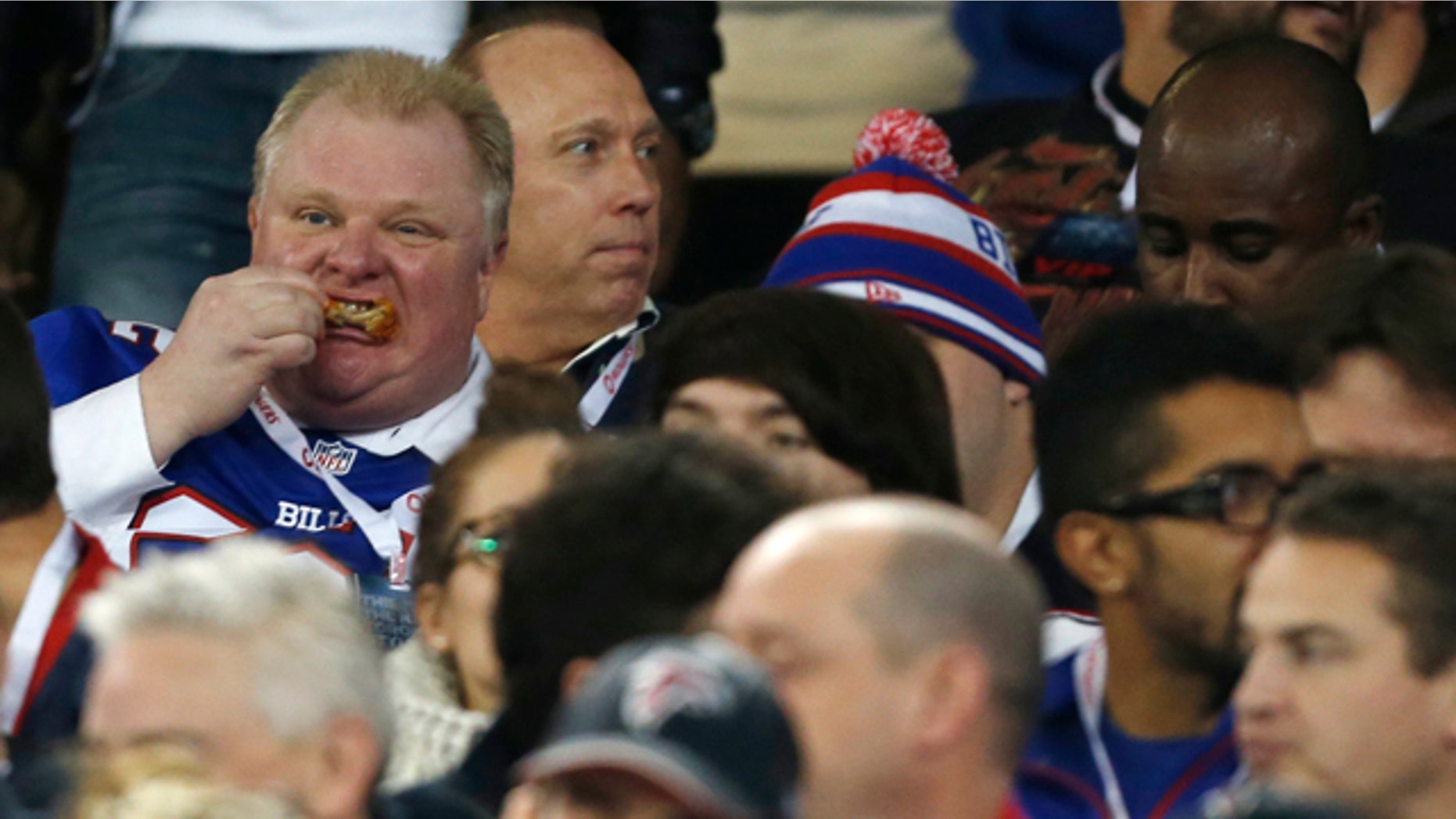 Dec. 1, 2013: Toronto Mayor Rob Ford eats during the first half of an NFL football game between the Atlanta Falcons and the Buffalo Bills.