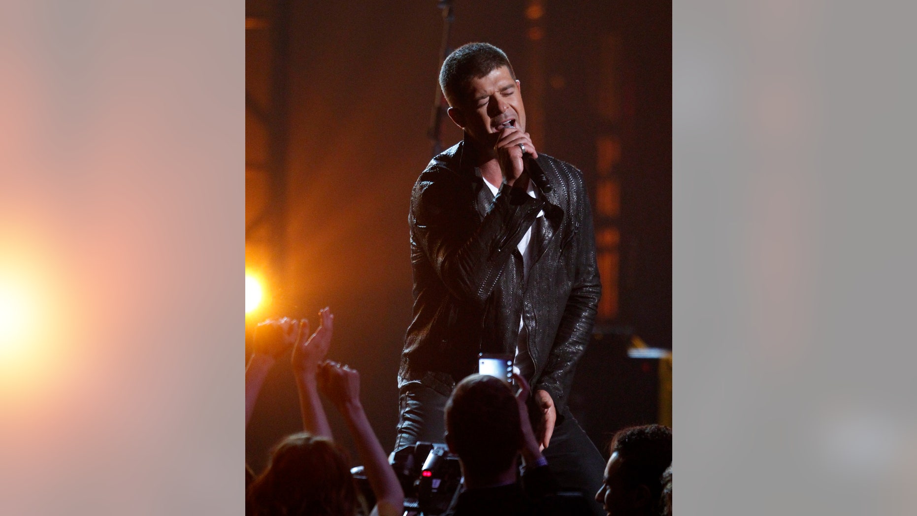 May 18, 2014. Singer Robin Thicke performs "Get Her Back" at the 2014 Billboard Music Awards in Las Vegas, Nevada.