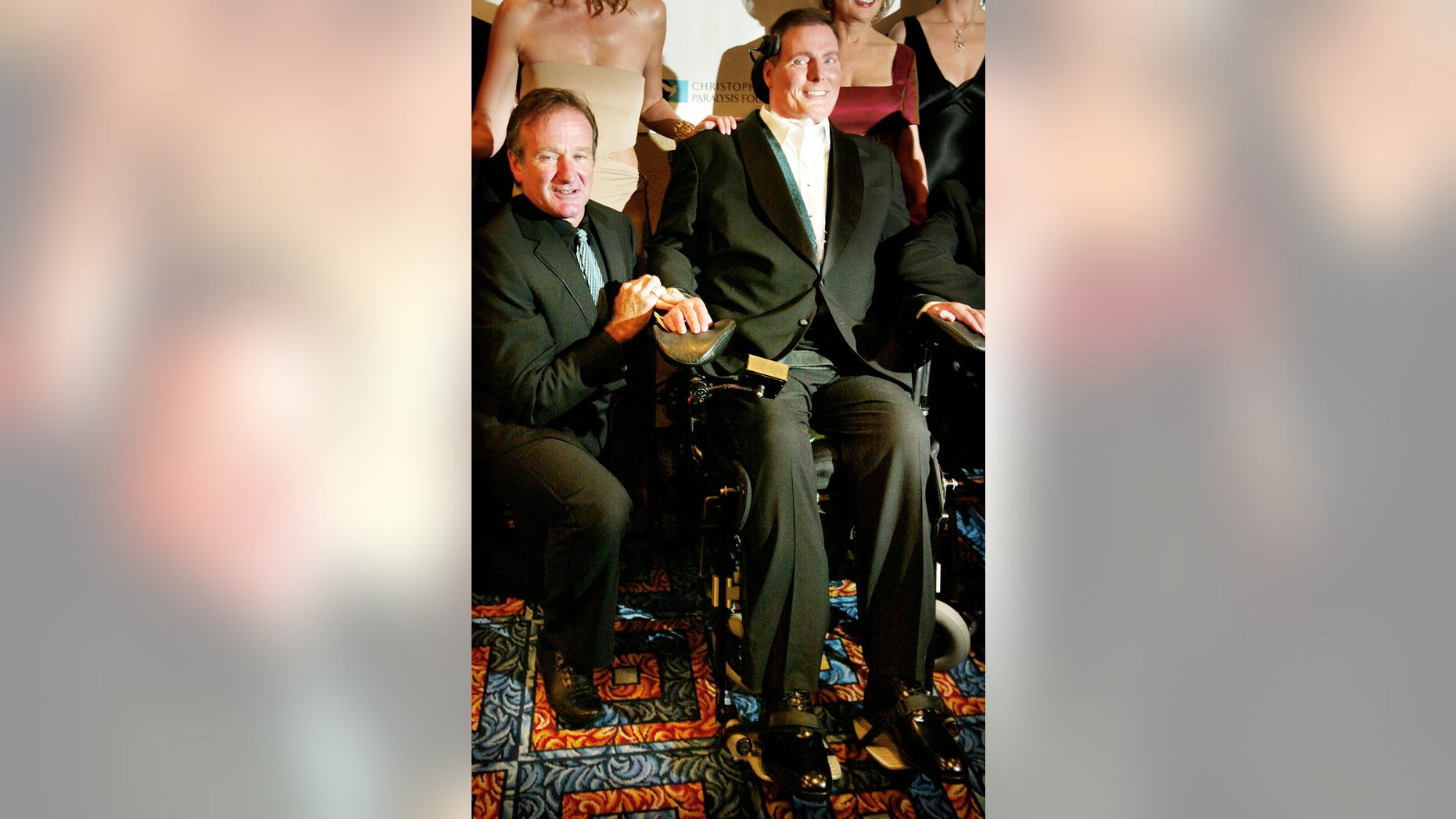September 25, 2002. Actors Christopher Reeve (R) and Robin Williams pose for photographers as they arrive at party to celebrate Reeve's 50th birthday in New York City.