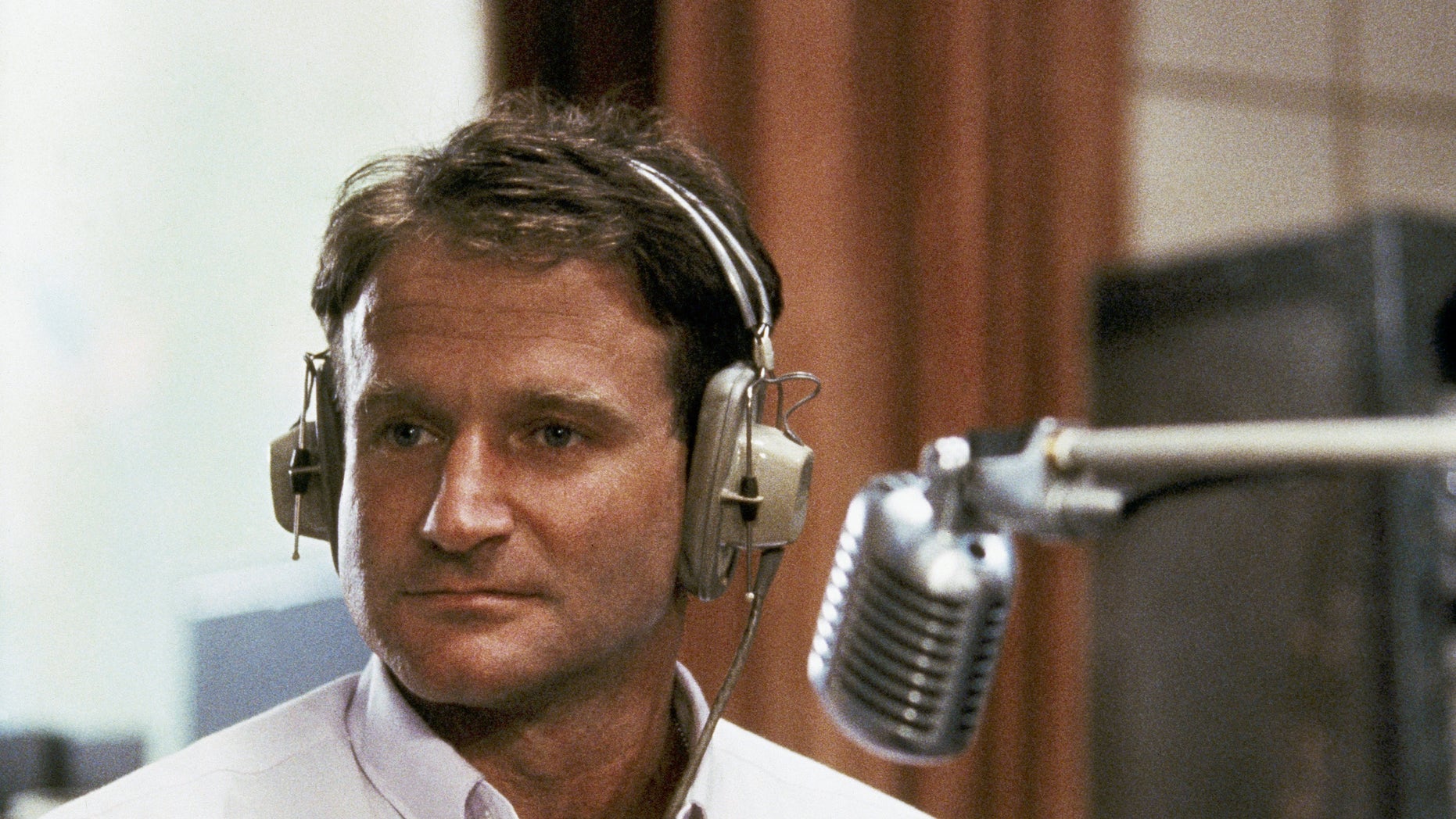Robin Williams in character as disc-jockey Adrian Cronauer in director Barry Levinsons comedy drama "Good Morning Vietnam."