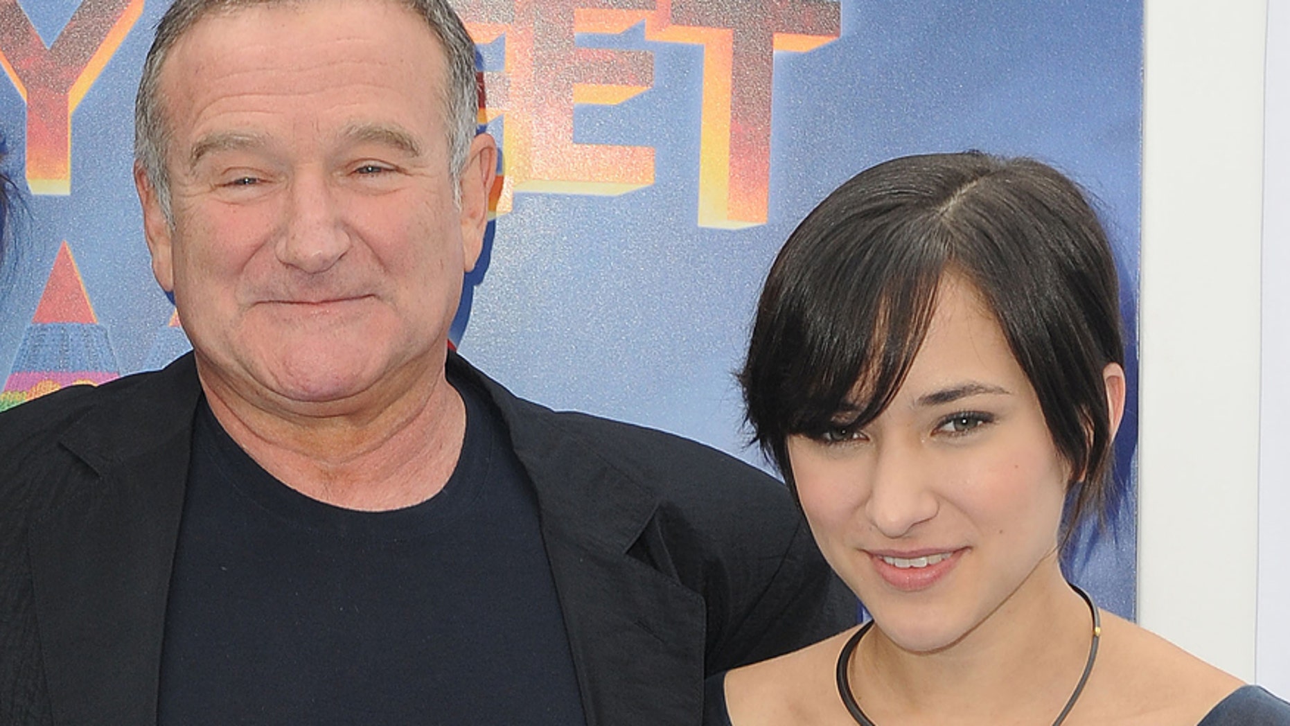 This Nov. 13, 2011 file photo shows actor Robin Williams, left, and his daughter, Zelda at the premiere of "Happy Feet Two" in Los Angeles.