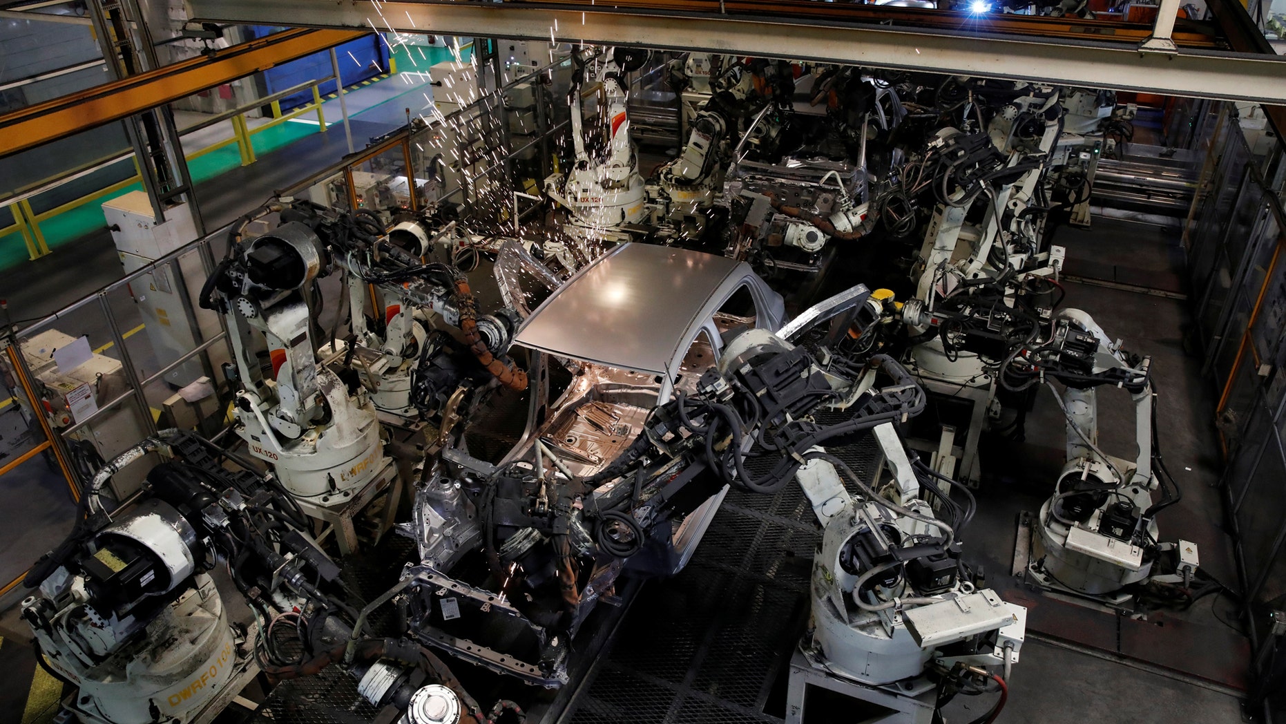 File photo: Robots assemble a Toyota Motor Corp. Yaris at the company's plant in Onnaing, near Valenciennes, France, May 17, 2017. (REUTERS/Benoit Tessier)