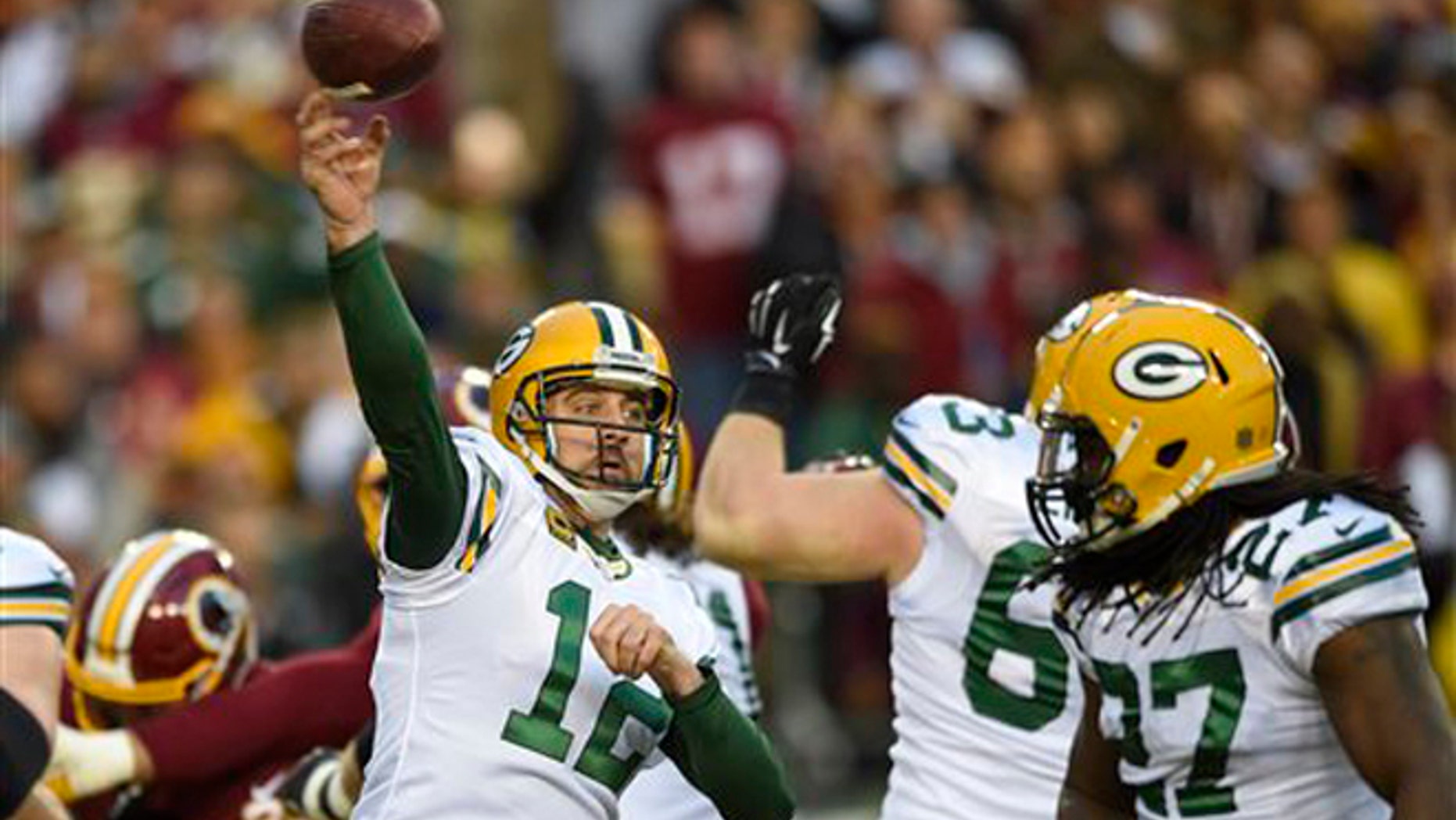 Green Bay Packers quarterback Aaron Rodgers (12) throws a pass during the first half of an NFL wild card playoff football game against the Washington Redskins in Landover, Md., Sunday, Jan. 10, 2016. (AP Photo/Nick Wass)