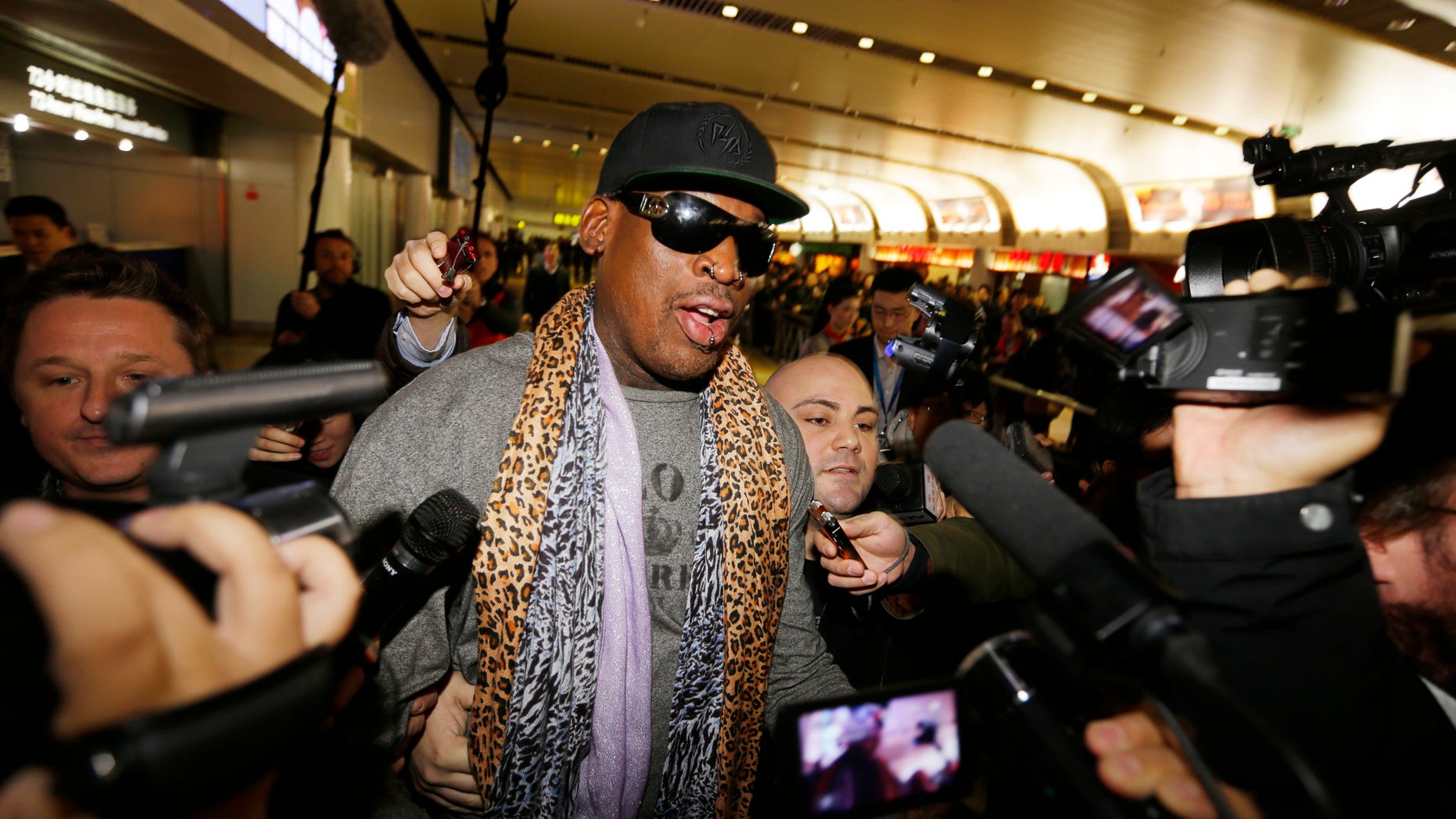 December 23, 2013. Former NBA basketball player Dennis Rodman speaks to the media after returning from his trip to North Korea at Beijing airport.
