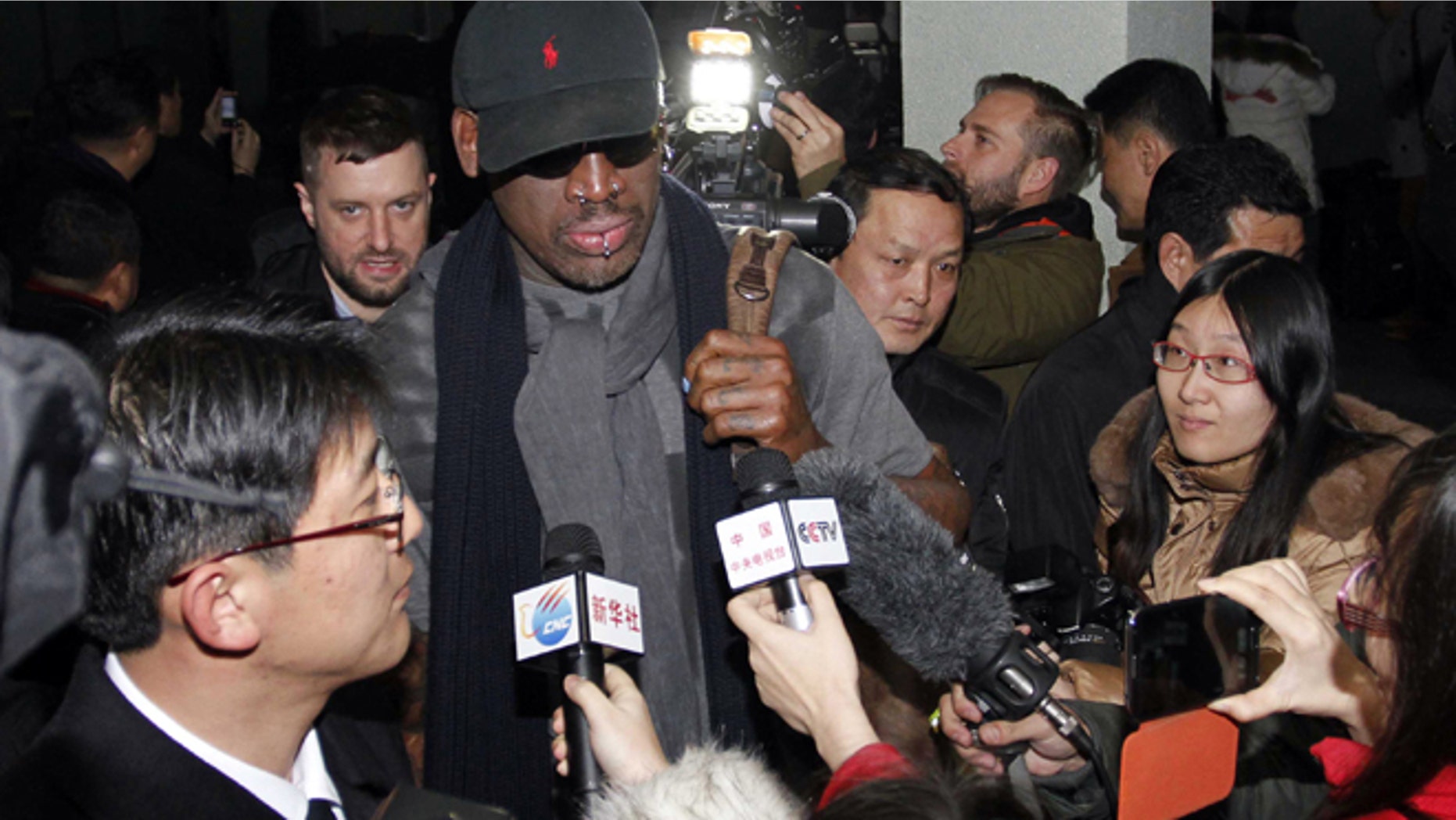 Feb. 26, 2013: Flamboyant former NBA star Dennis Rodman is surrounded by journalists upon arrival at Pyongyang Airport, North Korea. The American known as "The Worm" arrived in Pyongyang, becoming an unlikely ambassador for sports diplomacy at a time of heightened tensions between the U.S. and North Korea.