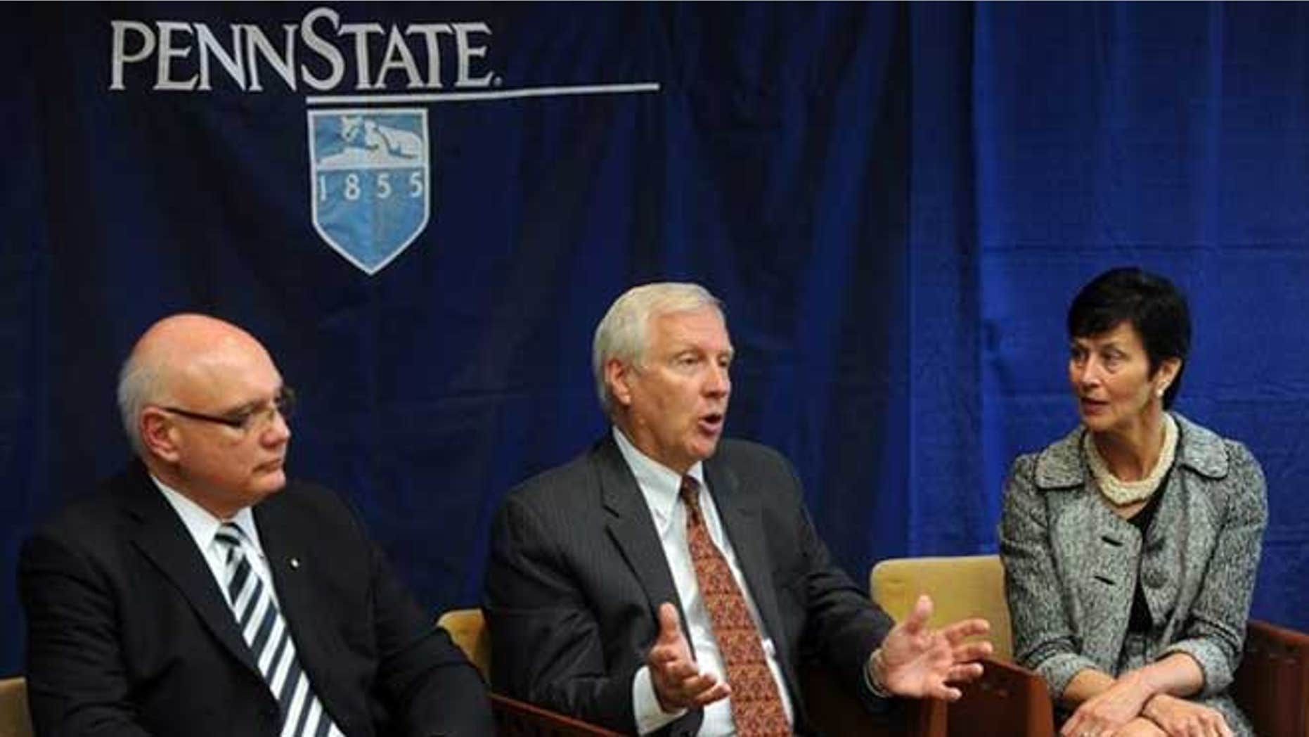 July 23, 2012: Penn State president Rodney Erickson, center, talks during an interview with the Centre Daily Times in State College, Pa.