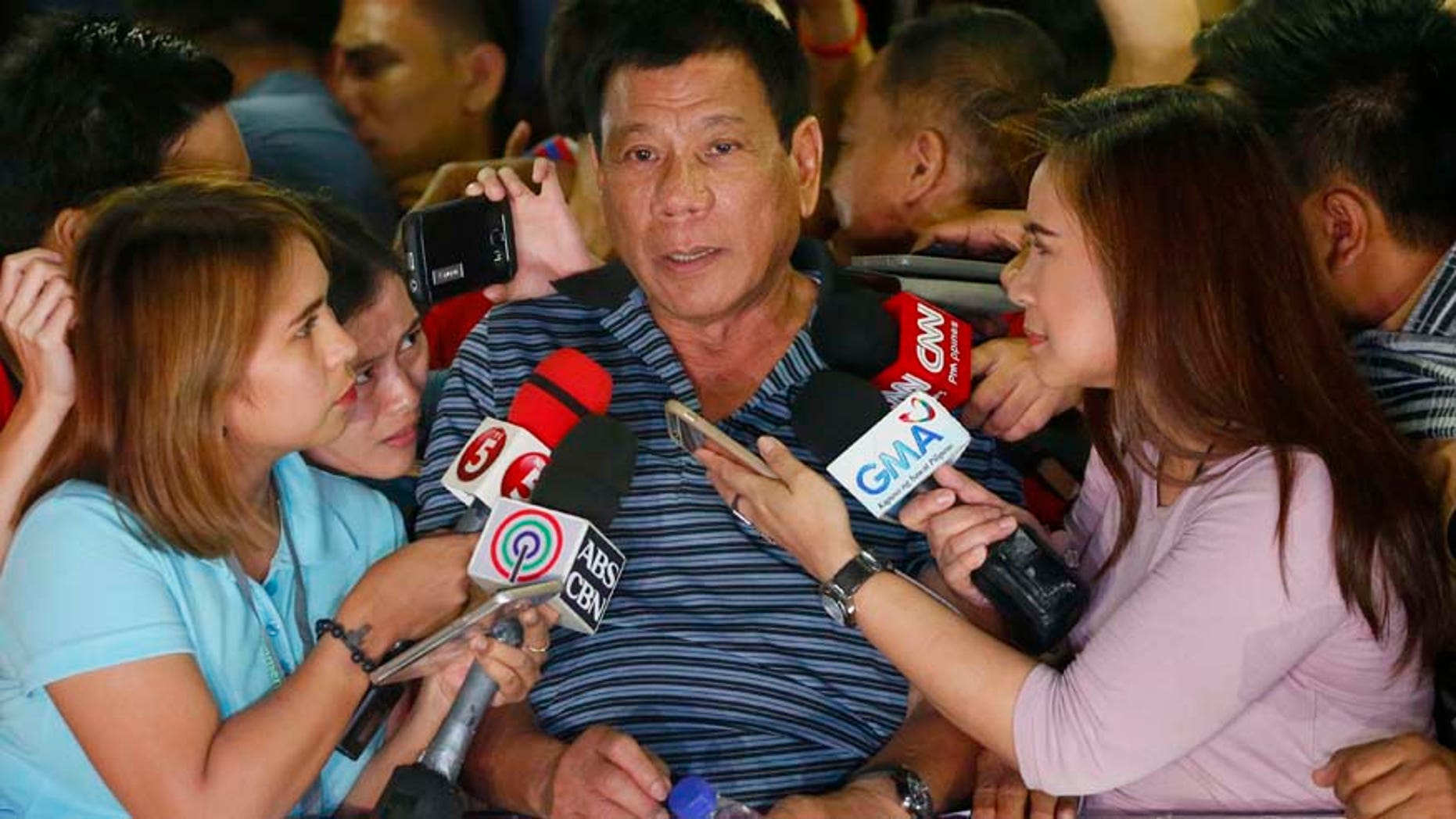 April 22, 2016: Front-running presidential candidate Mayor Rodrigo Duterte talks to the media during a campaign sortie at Silang township, Cavite province south of Manila, Philippines