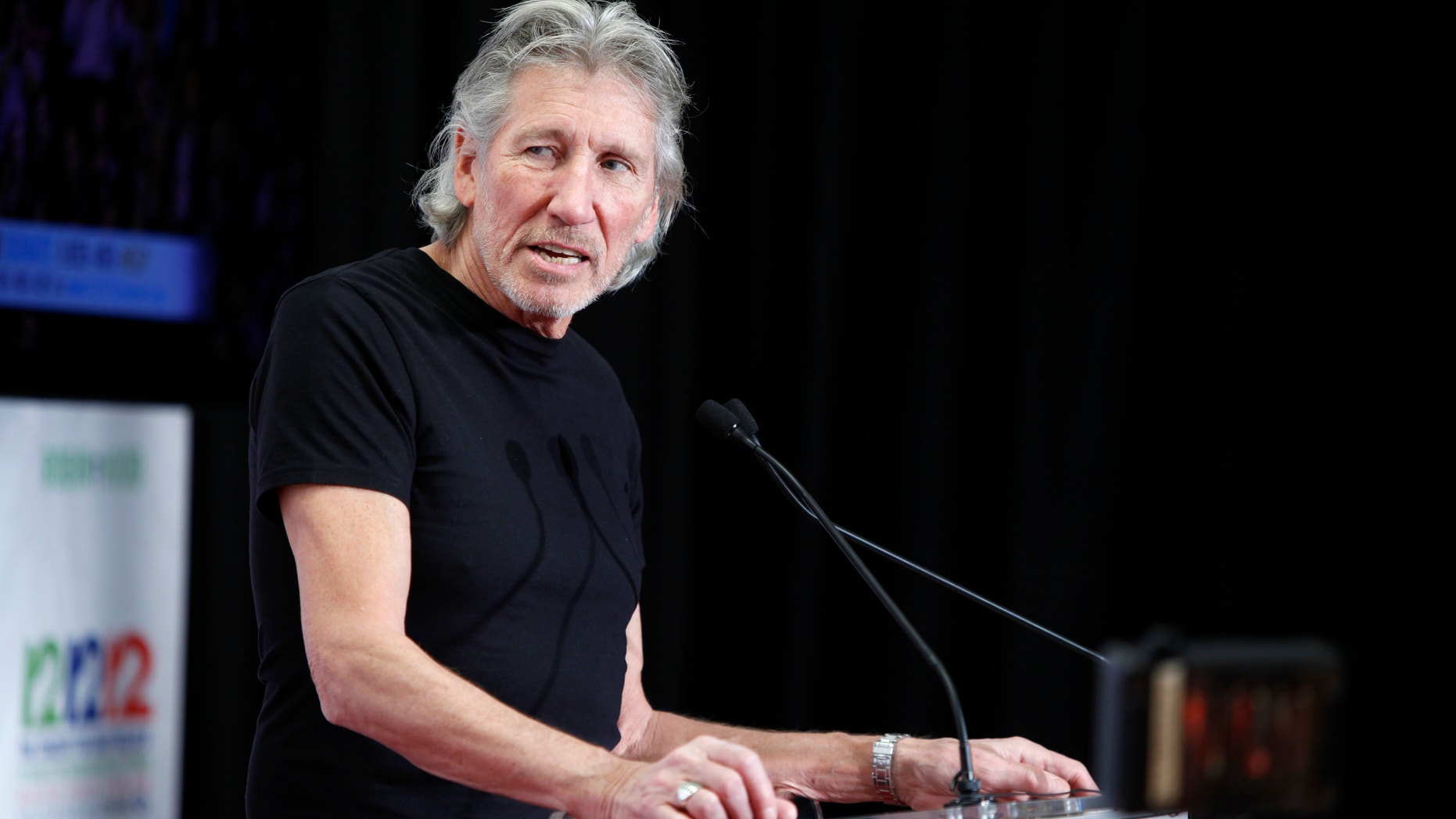 Musician Roger Waters speaks to the media backstage during the "12-12-12" benefit concert for victims of Superstorm Sandy at Madison Square Garden in New York, December 12, 2012.