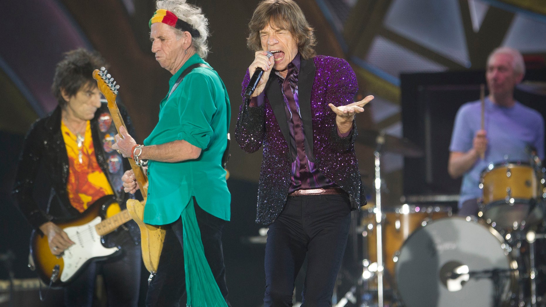 FILE - In this June 4, 2014, file photo, Rolling Stones singer Mick Jagger, performs with Keith Richards, second left, Ronnie Wood, left, and drummer Charlie Watts during a concert in Hayrkon Park in Tel Aviv, Israel. The Stones will kick off a 15-city stadium tour of North America on May 24 at Petco Park in San Diego, Calif. (AP Photo/Ariel Schalit, File)